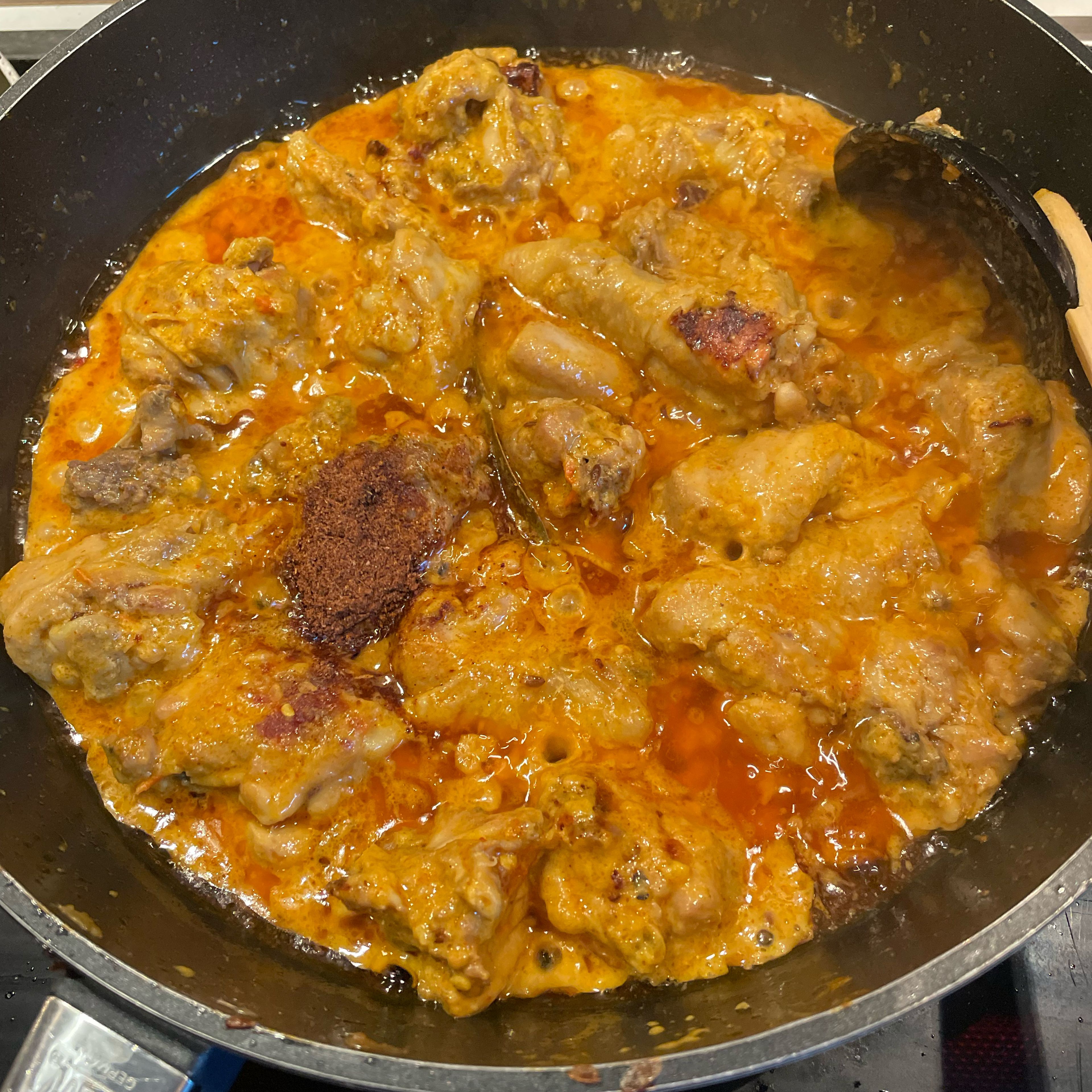 Uncover, stir in the remaining spices (nutmeg, mace, garam masala). Turn the chicken, cover and simmer for 10 more minutes. Then add water, bring to a boil and keep simmering another 2-3 minutes. You can garnish the dish with cilantro or mint. Serve with white bread, naan, chapati or rice.