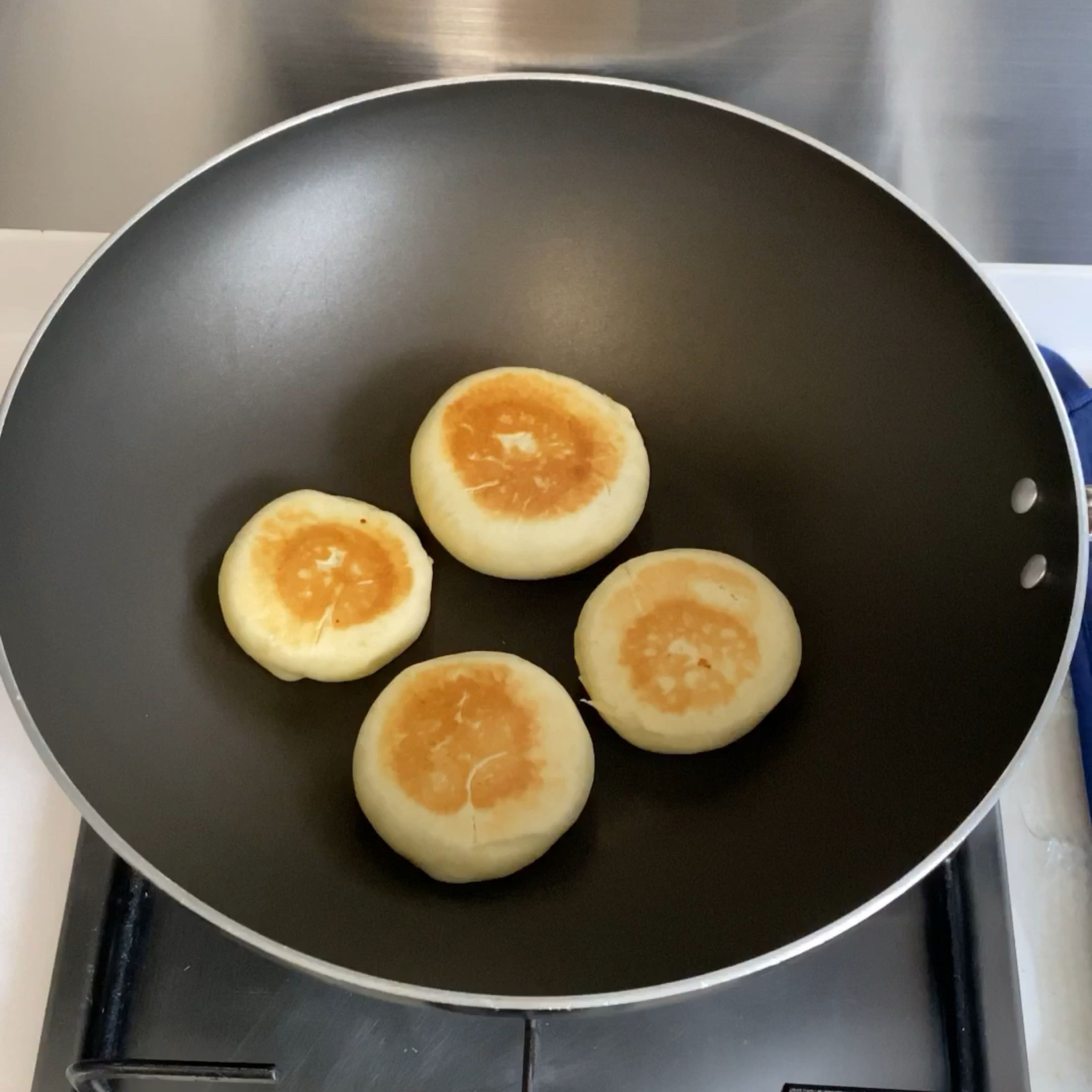 After 45 minutes, heat up pan for low heat and put the dough. Push gently and once the colour turns brown, flip to other side.