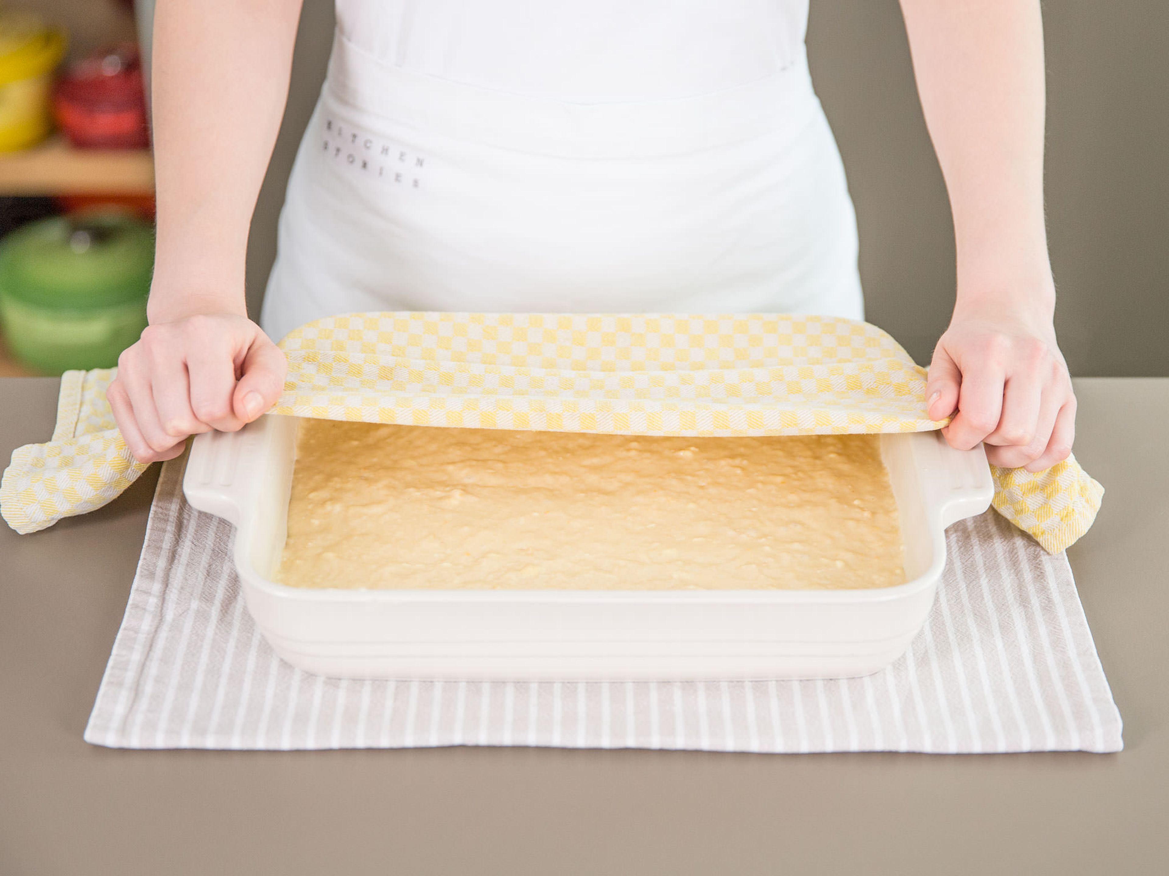Once dough has almost doubled in size, give it a gentle stir to deflate slightly, then transfer to baking dish and spread to cover the bottom evenly. Cover loosely with plastic wrap or a damp towel and set aside to rise for approx. 30 – 45 min. Preheat the oven to 175°C/350°F. When the cake is ready, bake it for approx. 25 min., or until it starts to turn golden brown on top and the center is just set.