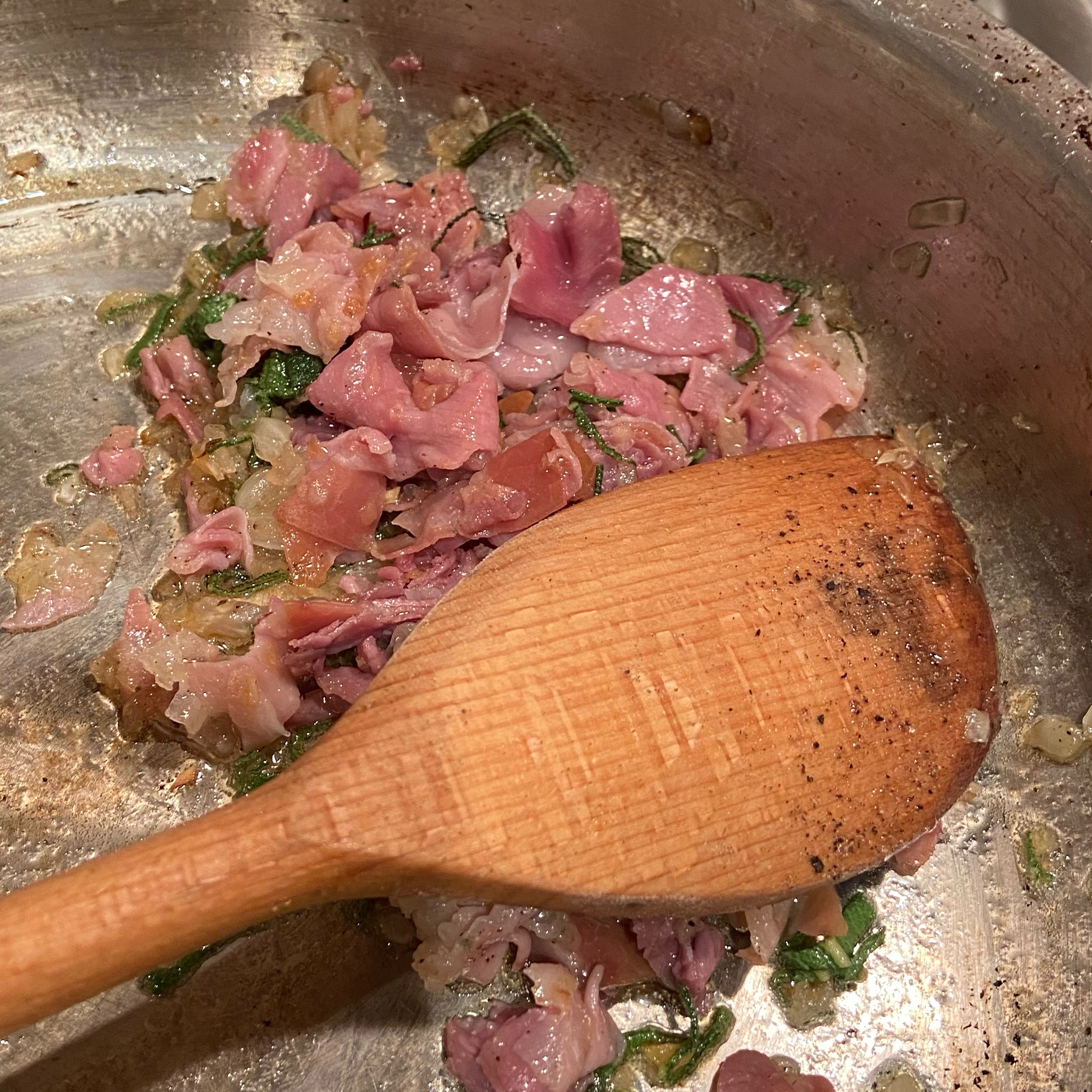 Add your cut sage to the meat and stir around a little. You might want to add a little more butter here and season with pepper. You don’t need to add salt as the meat is salty and the pasta is cooked in salt.
