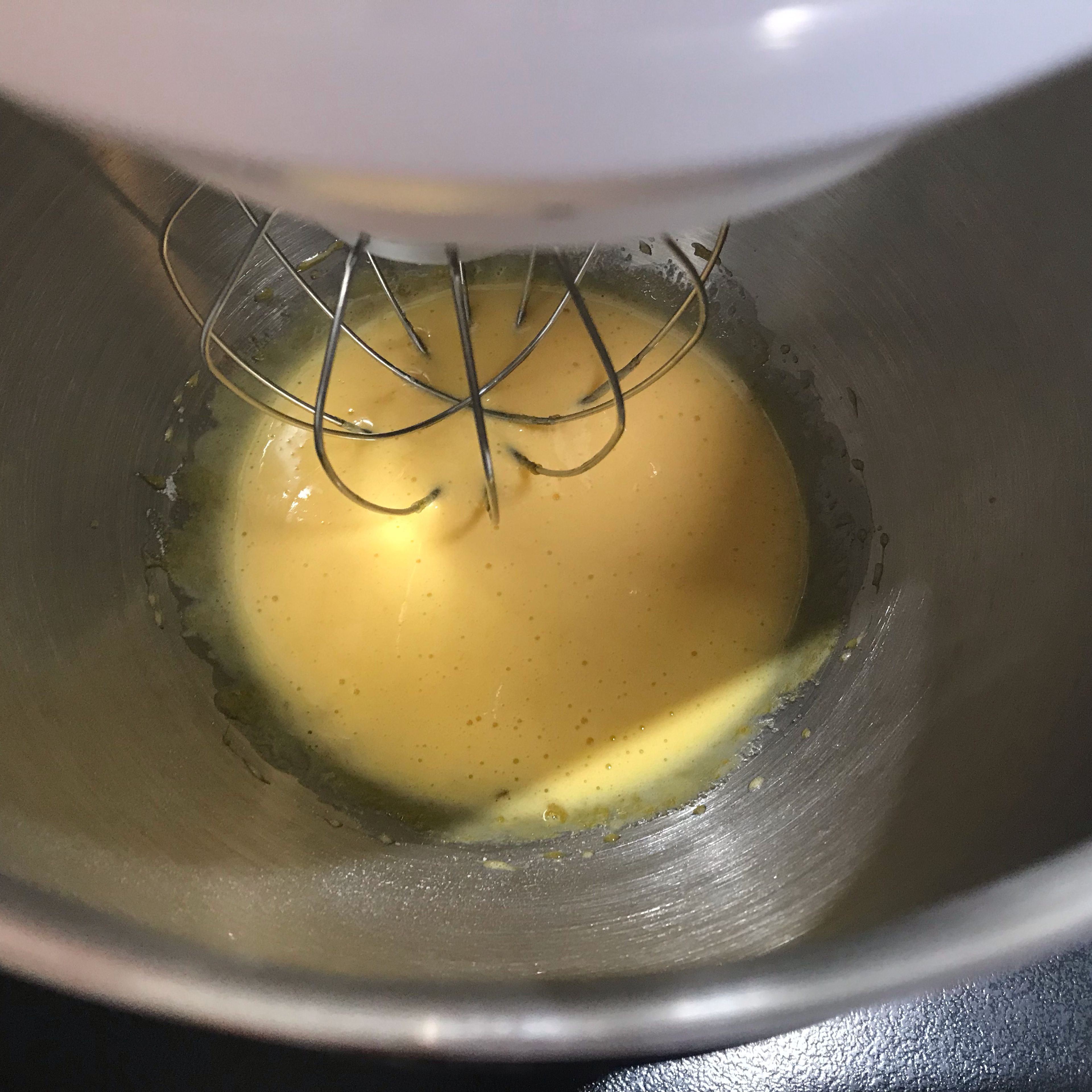 For the Pistachio Mousse, place egg yolks and sugar into the bowl of a stand mixer and whisk until pale and thick.