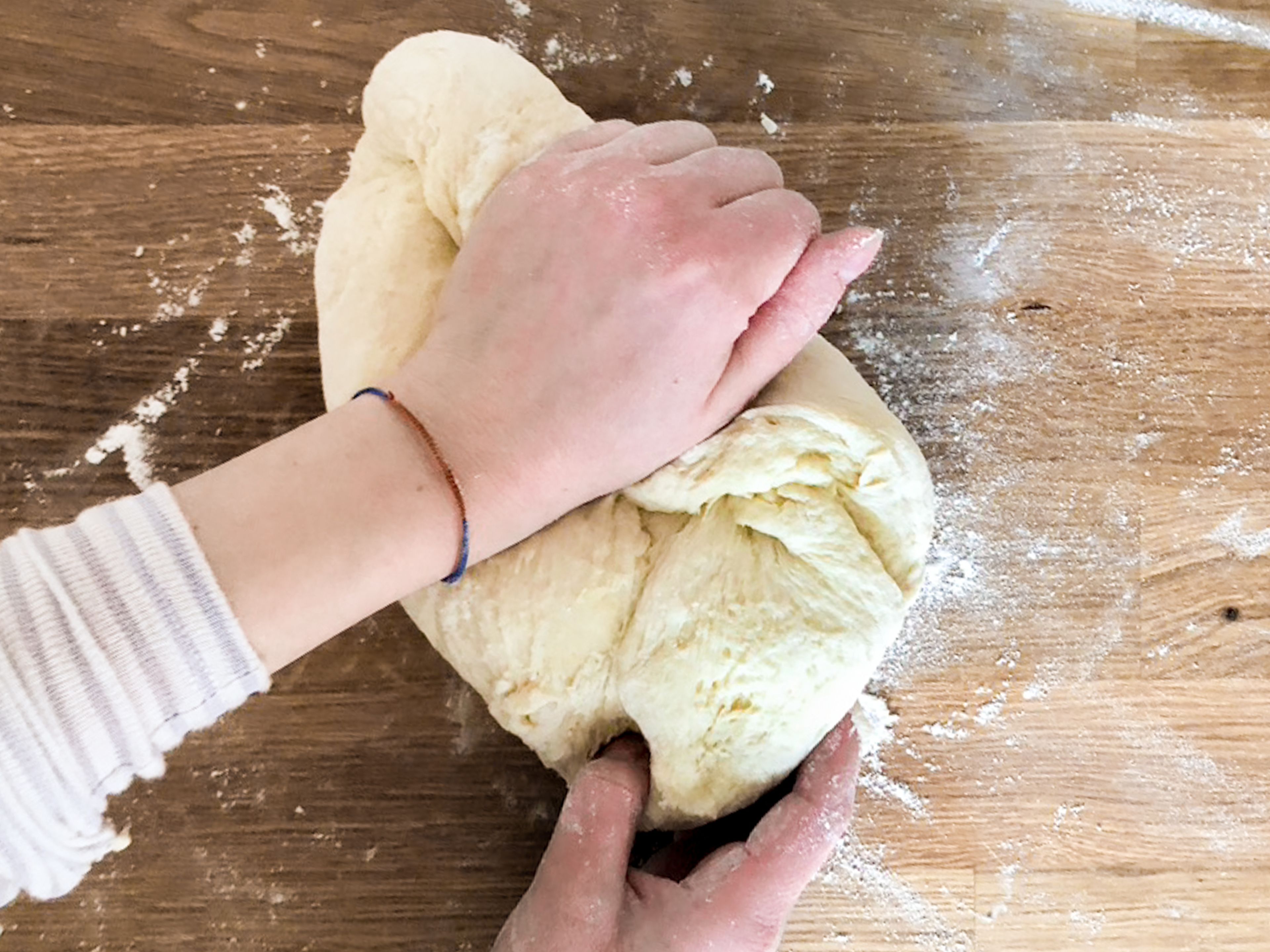 When the dough has risen and doubled in size, add the milk, sugar, flour, salt and butter and mix with a hand mixer until nice and smooth. Remove from the bowl and knead for 2-3 minutes on a clean work surface.  Form the finished dough into a square and wrap in cling film. Place in a container and leave to rest in the fridge overnight.