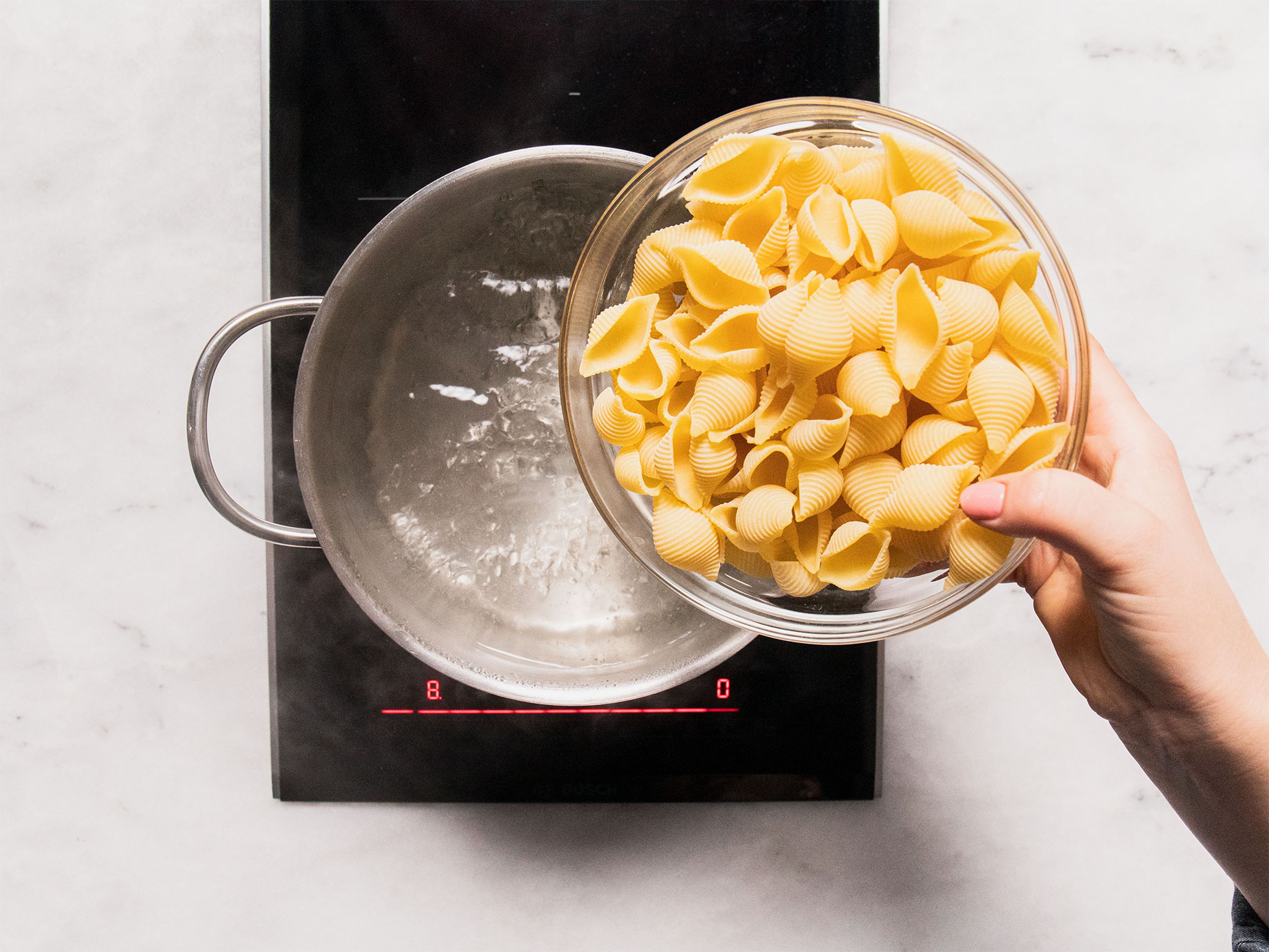 Bring a pot of water and salt to a boil. Cook the conchiglioni according to package instructions or until al dente, then drain, and mix with the pumpkin sauce.