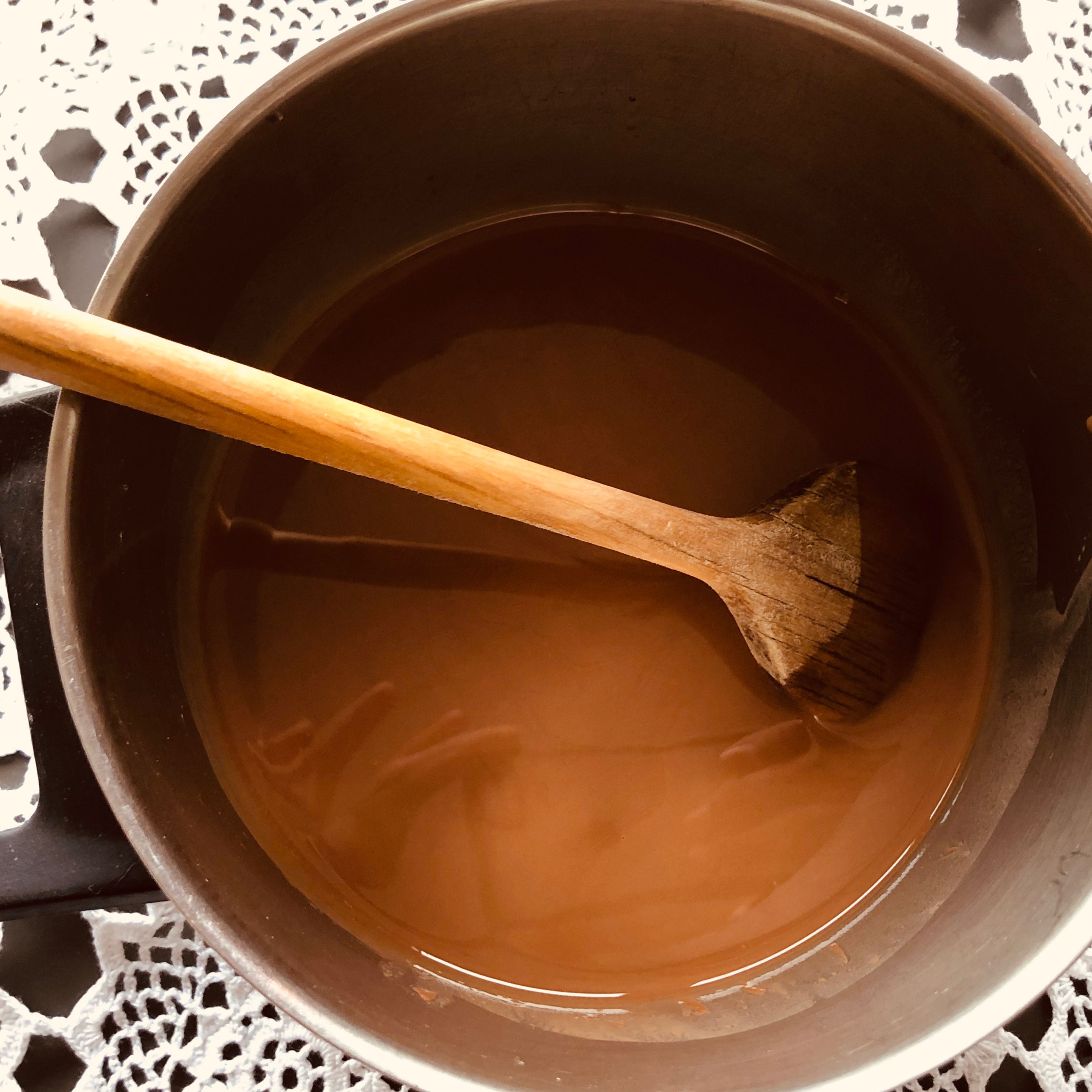 Add the coconut oil and 50 g of the chocolate chips to a small pot and heat it on low to medium heat for 2 minutes or until melted. then let sit for 2 minutes before whisking together.