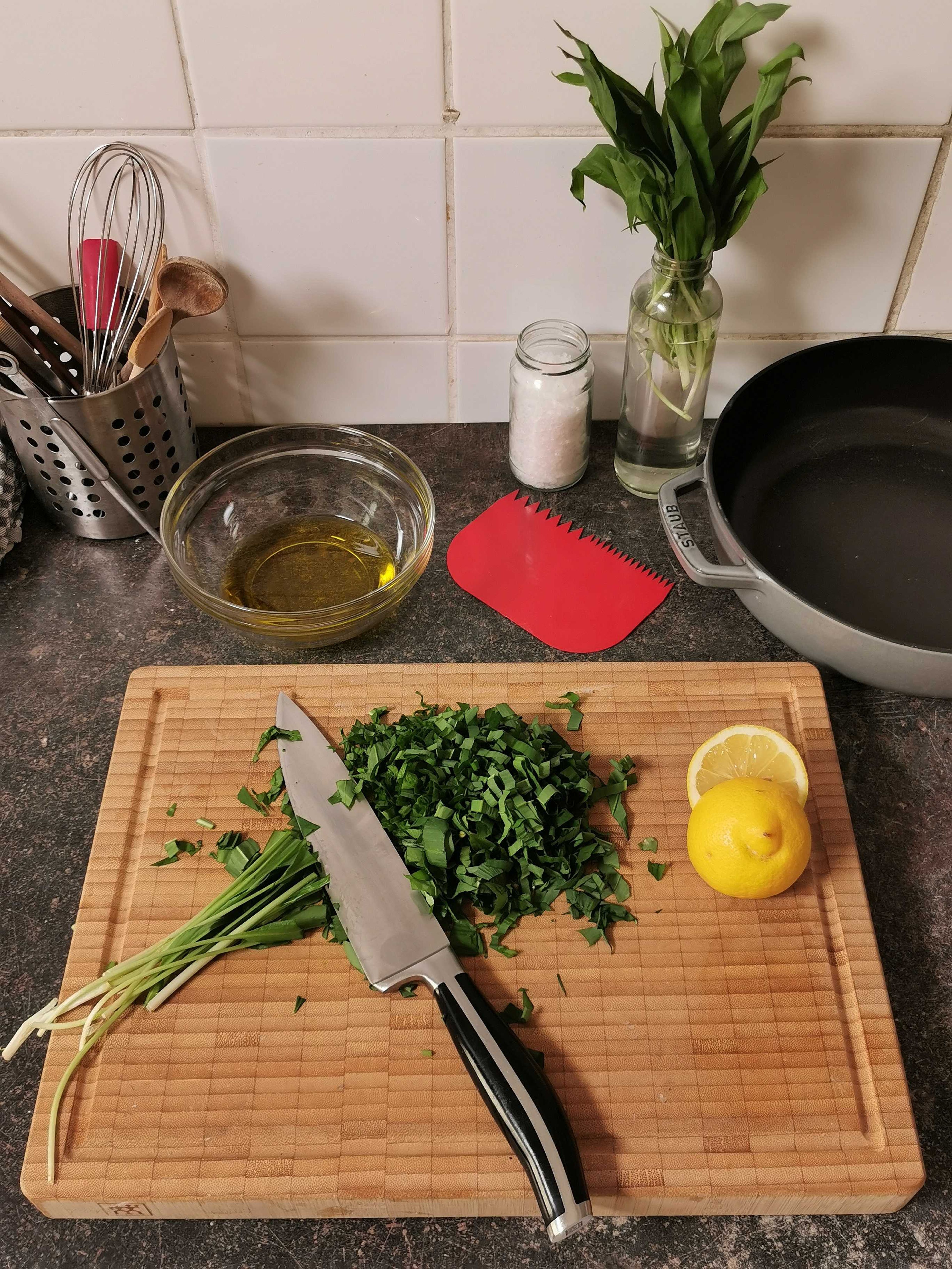 In the meantime, prepare the wild garlic oil. Finely chop the wild garlic and add to a bowl with the remaining olive oil, lemon juice, and salt, and mix well.