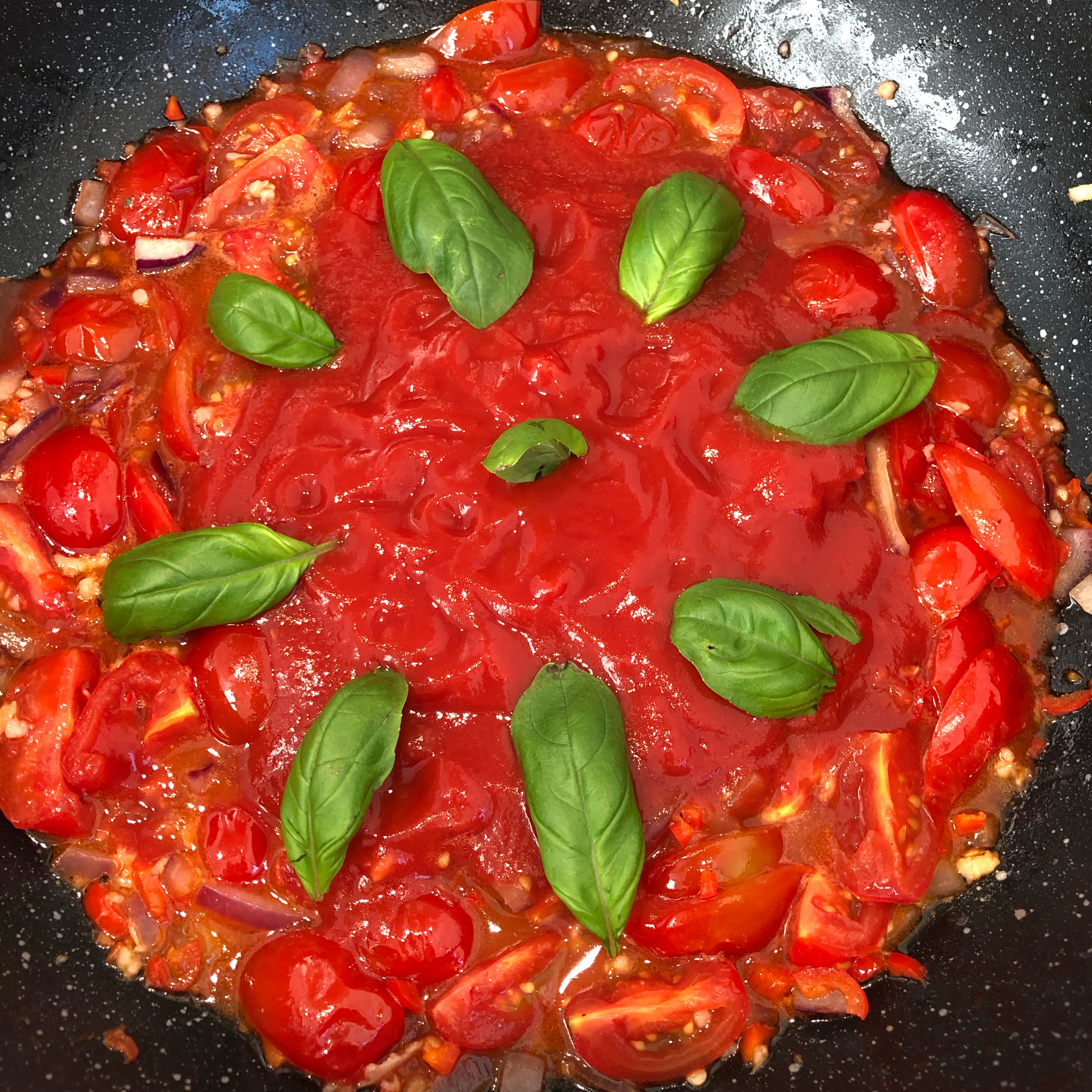 Add Passata and add basil. Stir through and cook for another 5 min on medium to high heat.