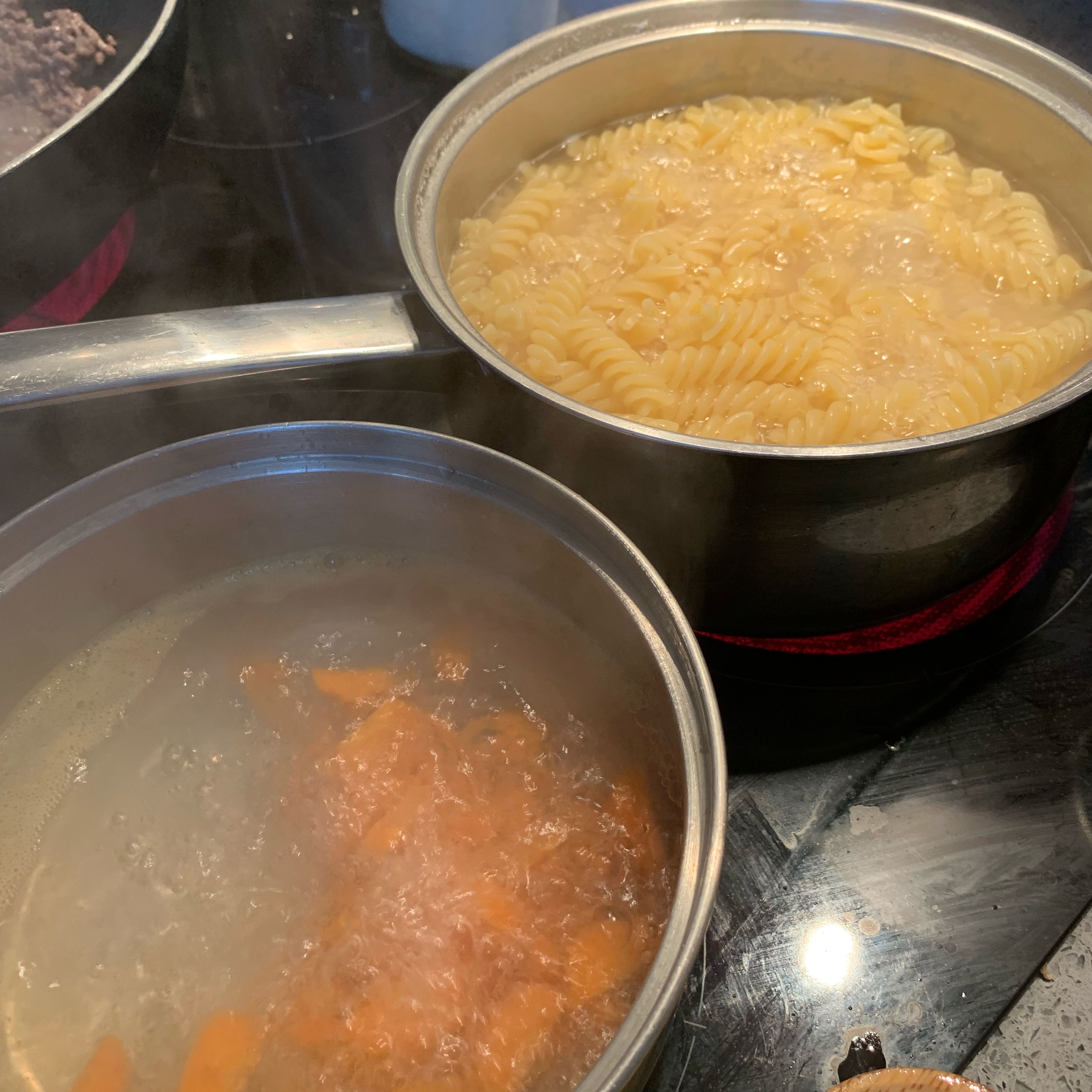 Start off by preparing your fusilli pasta and the carrots (previously cut in as large or as small pieces as you like). Boil the pasta and carrots till nice and al dente. I add a tea spoon of cooking or vegetable oil to the pasta as it prevents it from sticking to the pan.