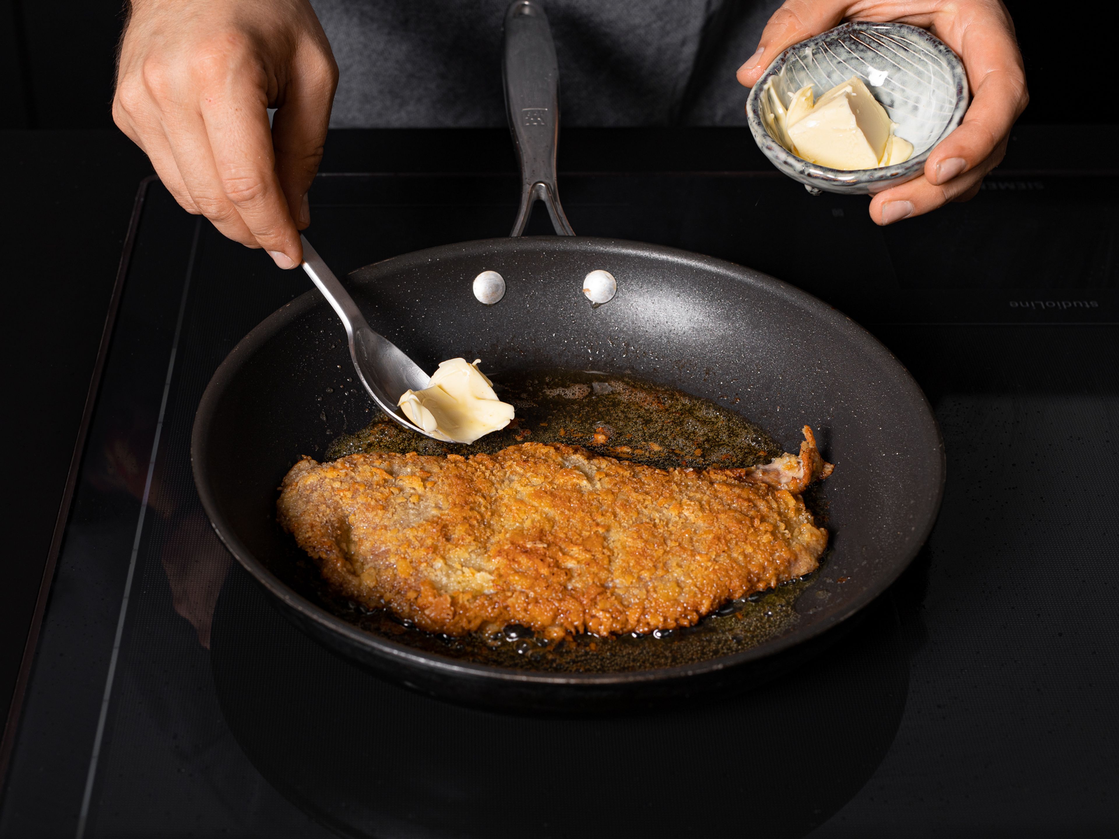 Add clarified butter to a frying pan over medium heat and fry each cutlet on both sides for approx. 2 – 3 min., or until golden brown and cooked through. Serve schnitzel with mushroom gravy, chopped parsley, and lemon wedges. Enjoy!