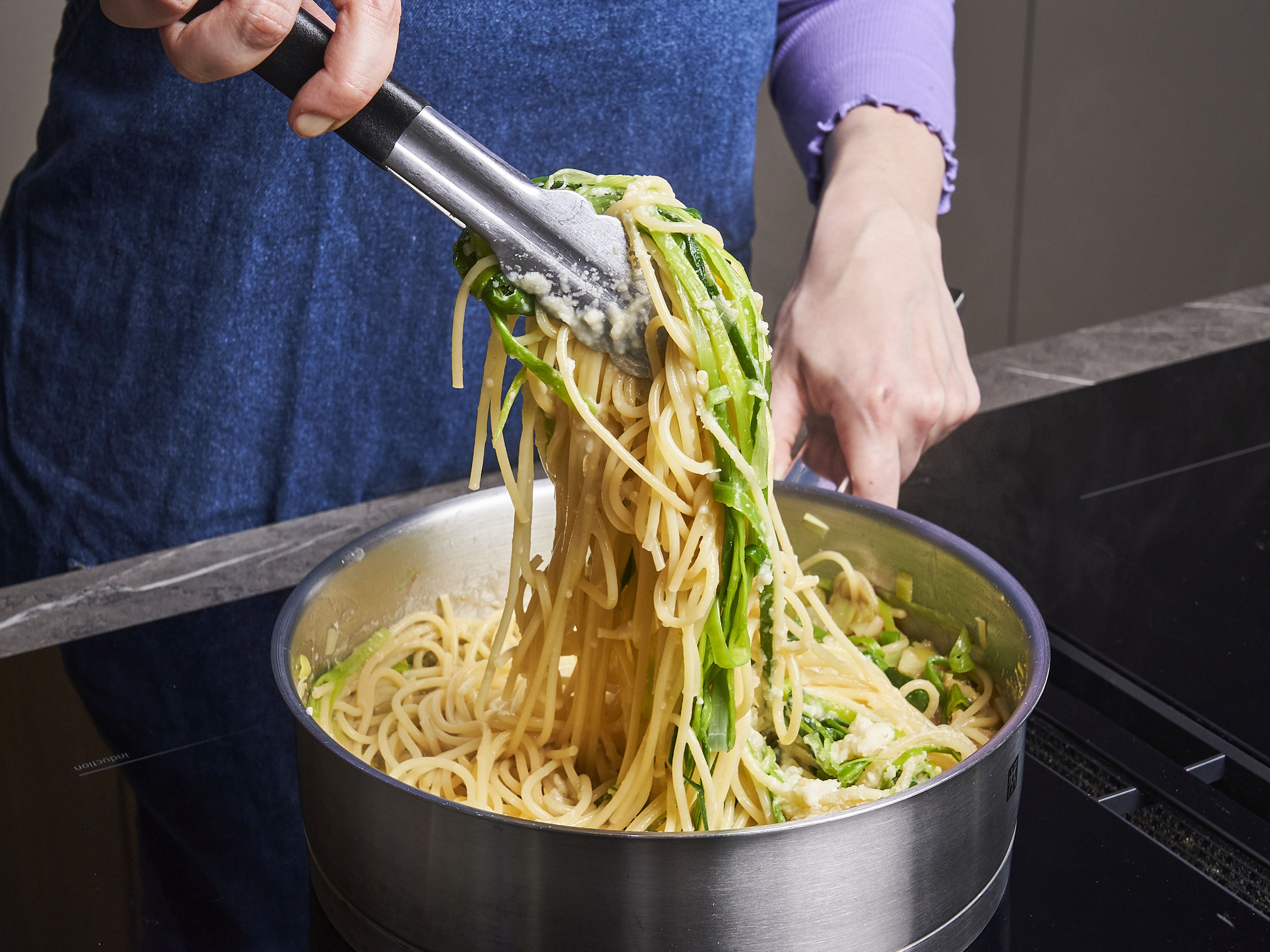 Add miso paste, parmesan, drained pasta with leek strips to leek whites and mix well over medium heat. Add in pasta water until a glossy sauce forms to your liking. Serve with extra parmesan on top and pepper.