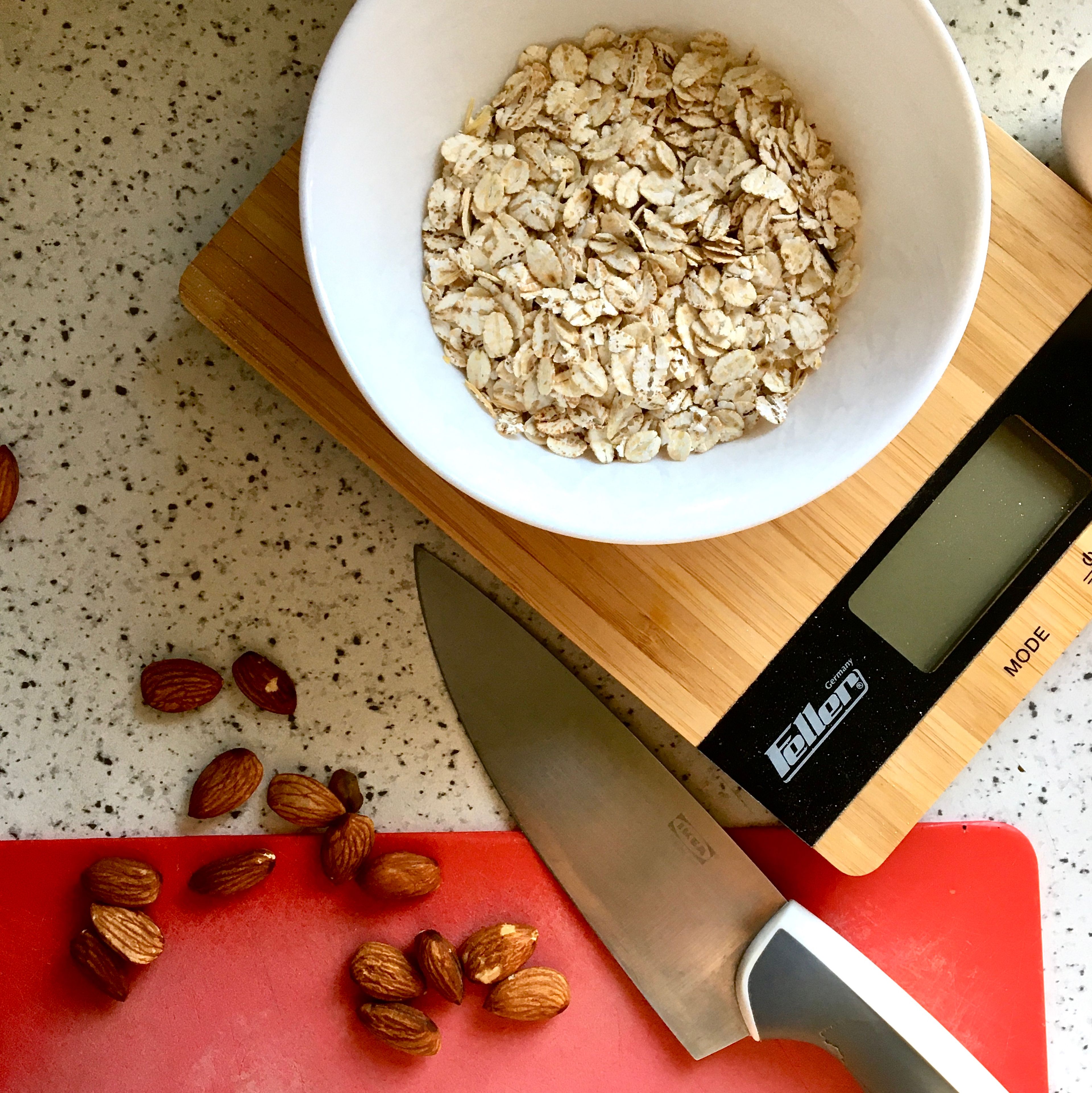In a small bowl mix half of the chopped almonds with 2 tbsp of rolled oats. In another small bowl reserve 1-2 tbsp of sugar. Set both aside. In a medium bowl whisk the remaining oats and almonds with flour, wheat bran, salt and baking powder.