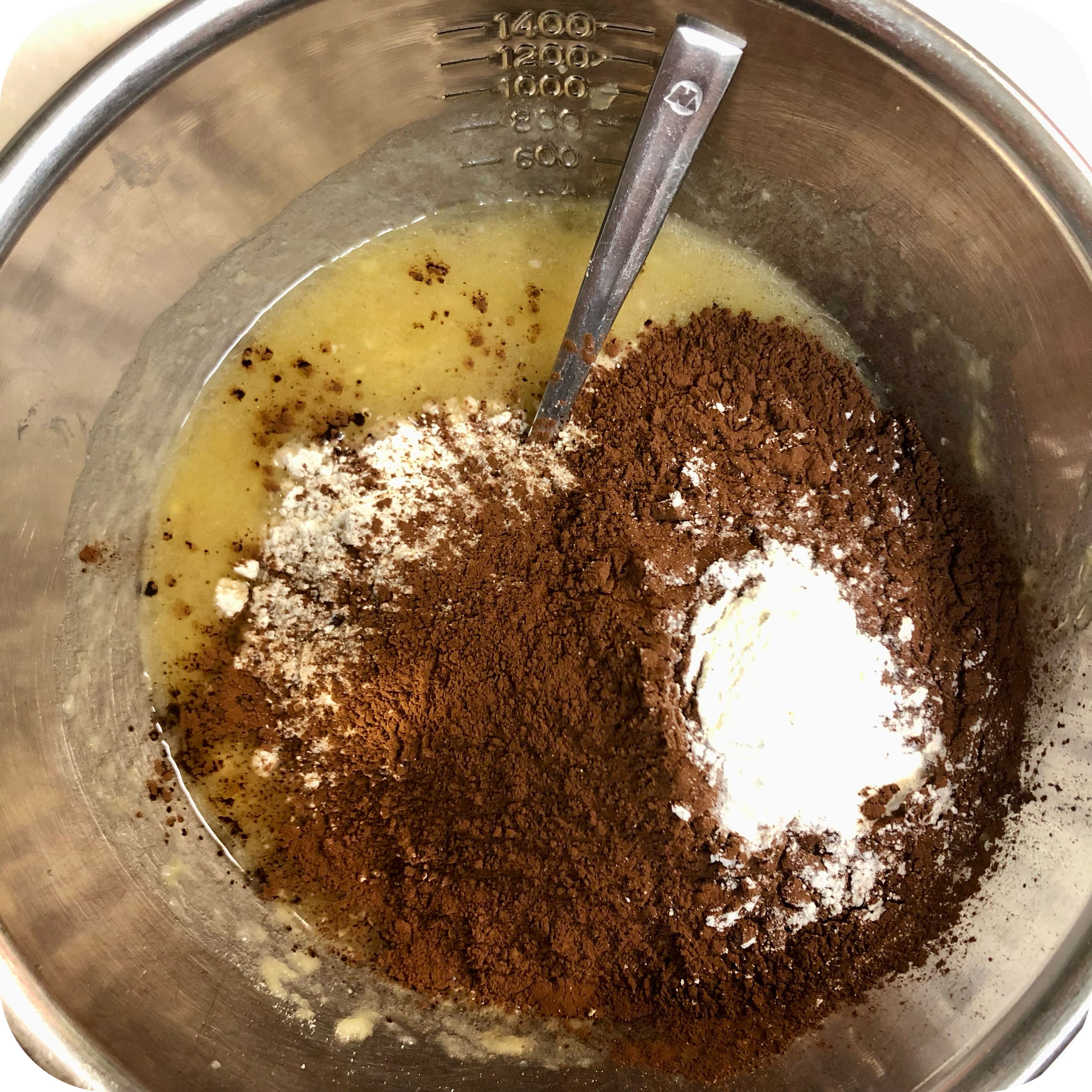 Add the oatmeal, cocoa powder and baking powder and mix well.