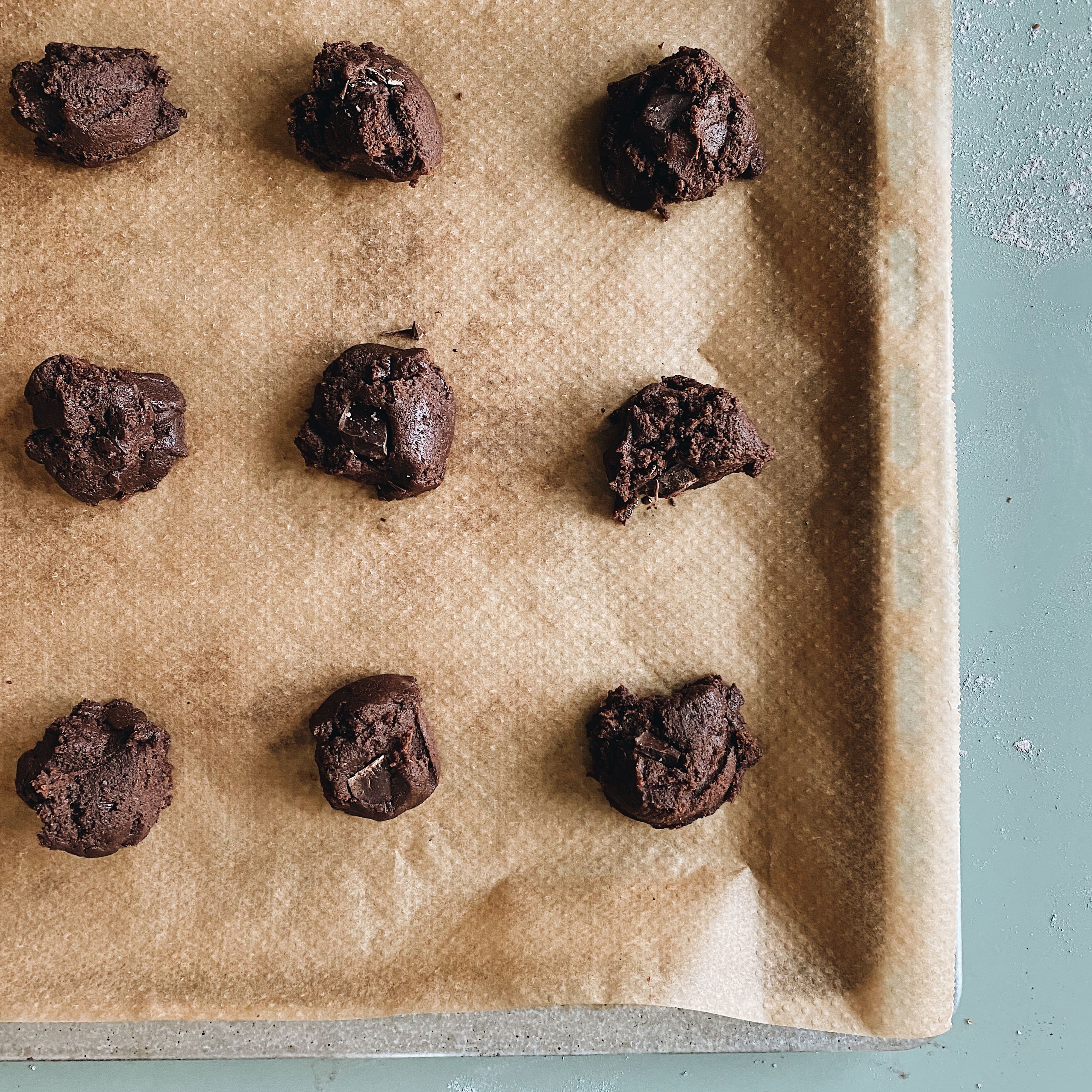 Line baking sheet with parchment paper. Drop dough on the sheet using a rounded tablespoon.