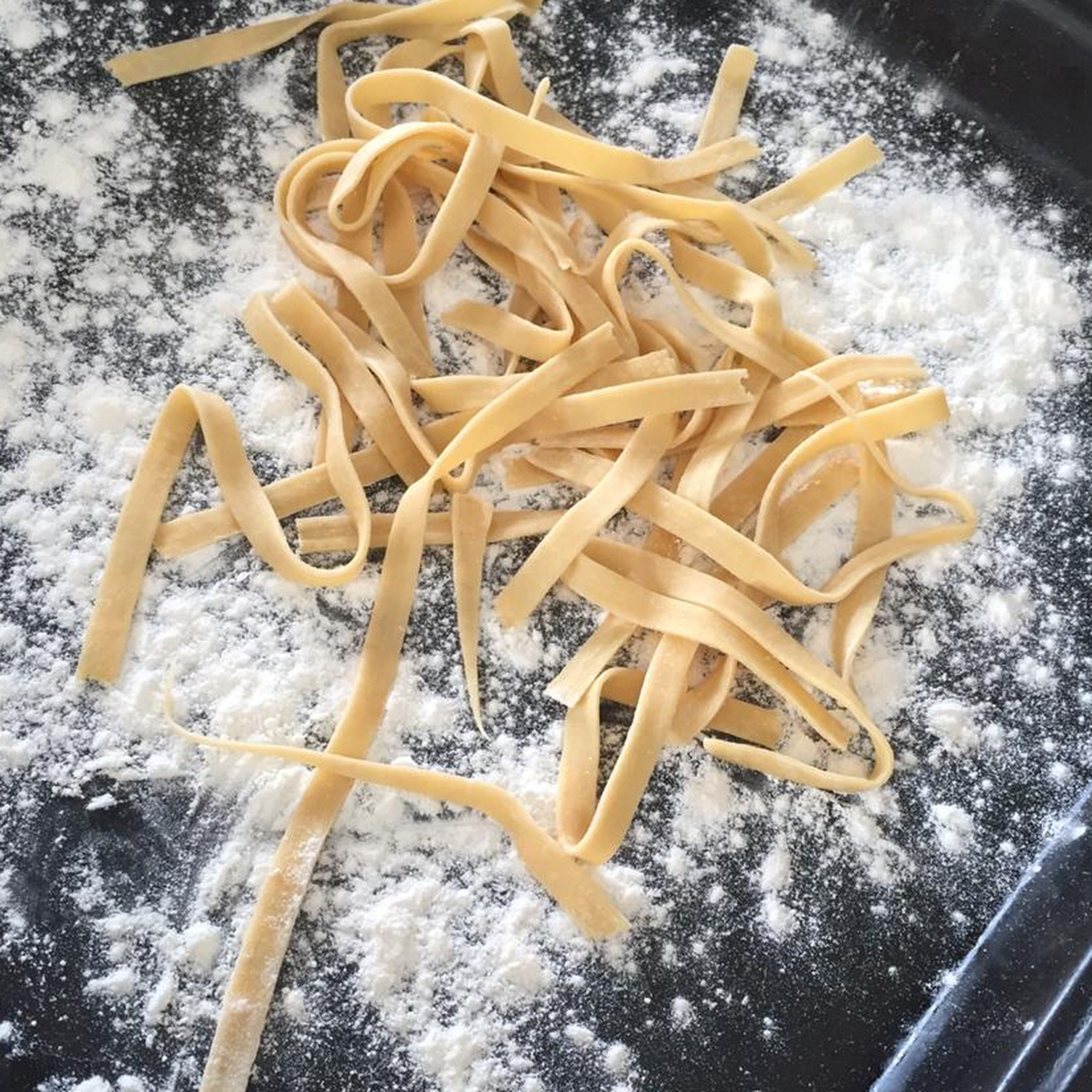 dust a pan with a bit of flour and toss the pasta into it. Make sure to coat the pasta with flour as well, to prevent it to stick to itself. (Quick tip: if your dough is more on the sticky side, you might need to coat it with flour while rolling it)