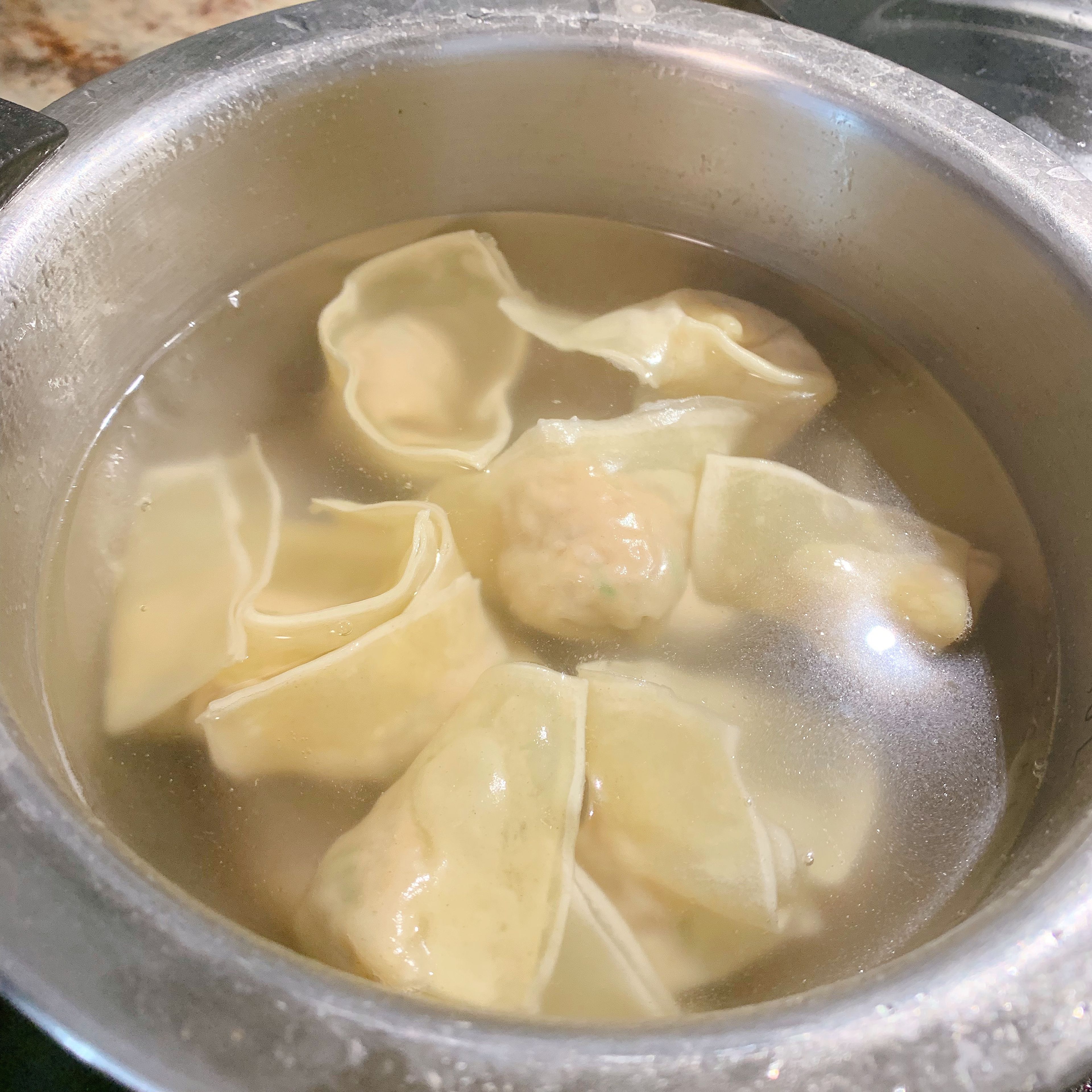 To enjoy now, cook wonton s in boiling water over medium-high heat. Once the water is boiling again, add some cold water. Repeat this process one more time. When the wontons are floating and the wrappers are almost translucent, they’re done. Store the rest in freezer for up to 1 month.