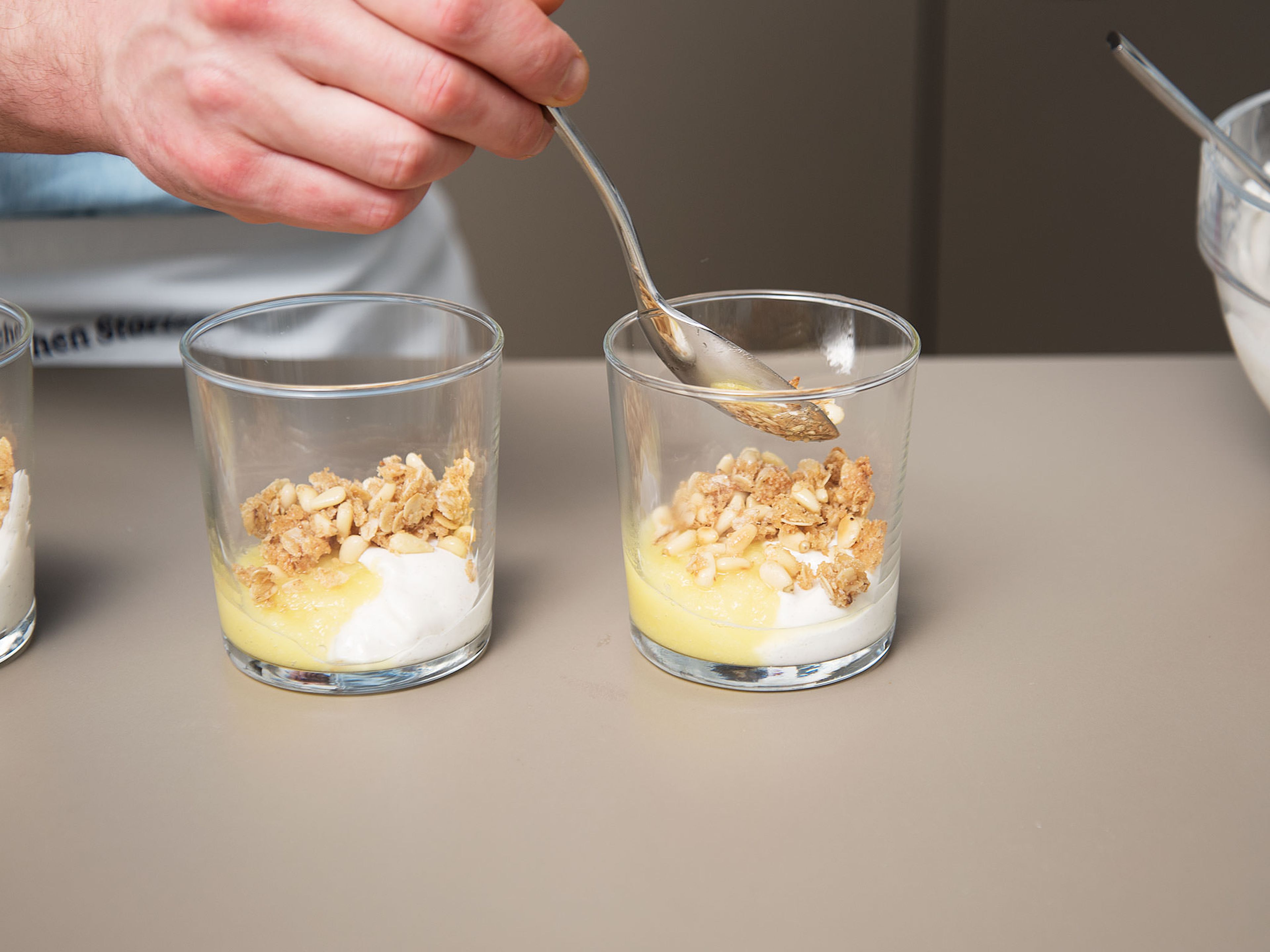 Mix quark with heavy cream, vanilla sugar, and remaining sugar in a large bowl. Equally distribute the cream in dessert cups. Layer the pineapple purée and the coconut mixture. Enjoy!