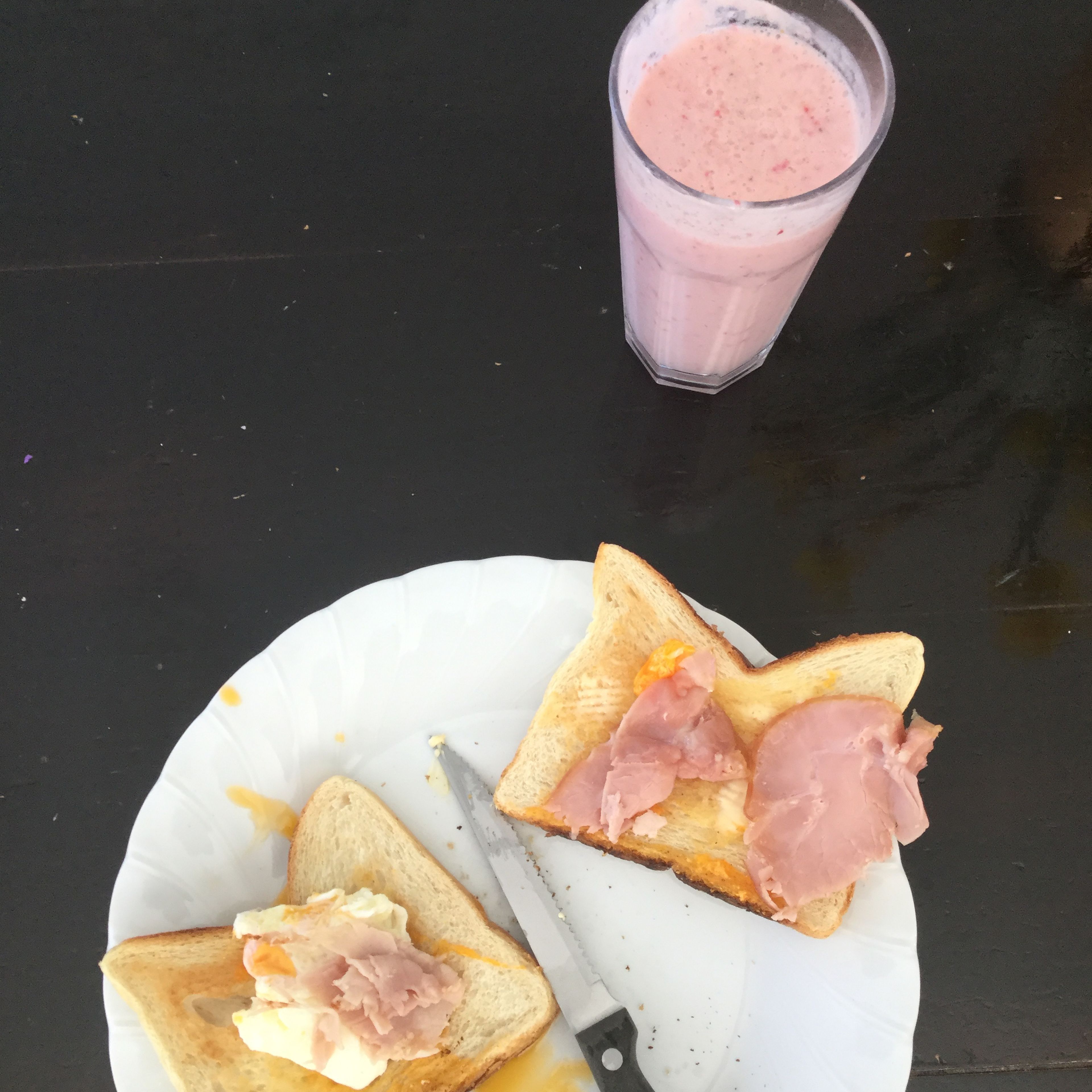 Strawberry smoothie w/ Egg, ham and toast breakfast!