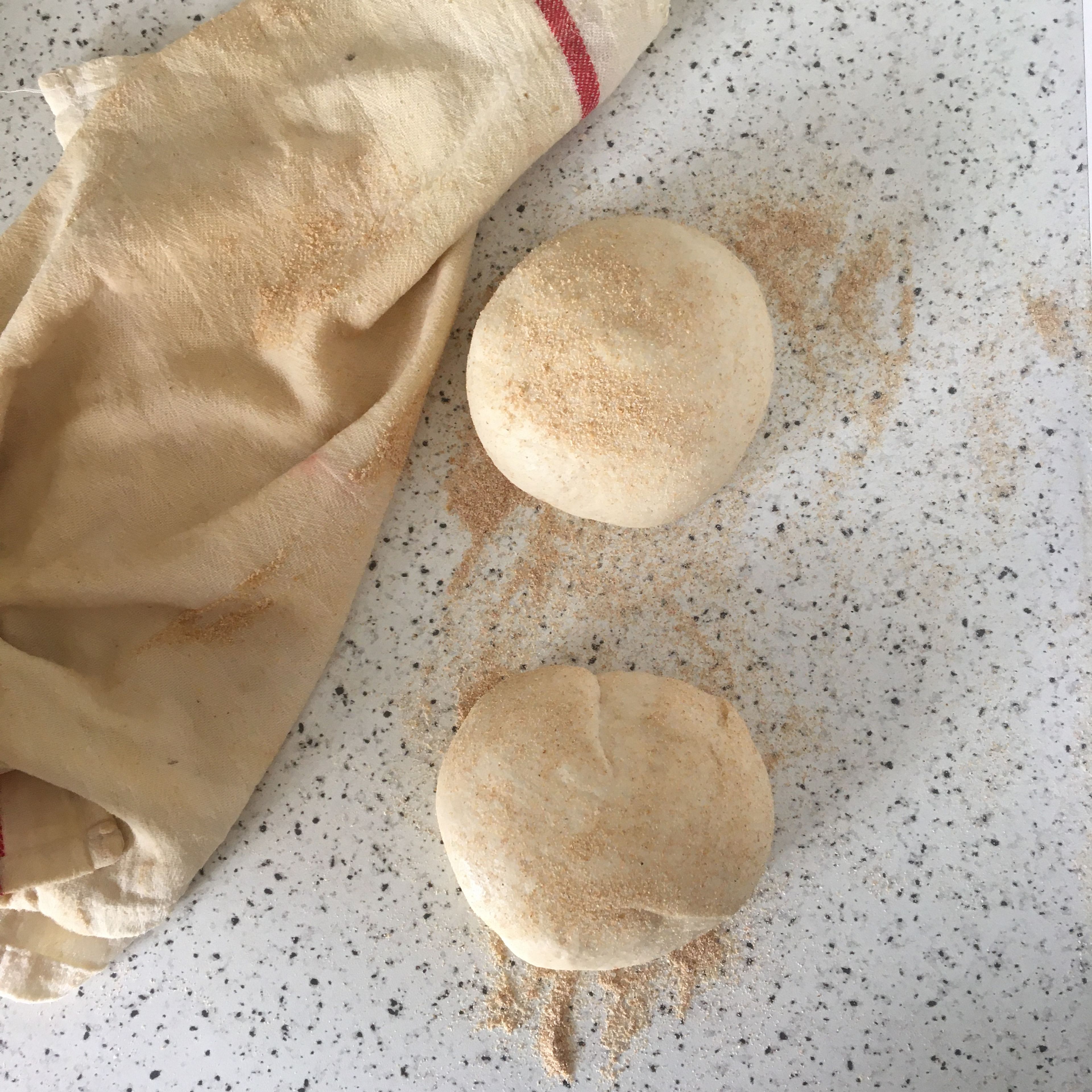 Carefully transfer the risen dough onto a floured work surface and fold for 2-4 times. Divide in two and cover again with the damp towel for second rise, about 30-45 min. Meanwhile, prepare the filling, preheat the oven to 240 C and lightly grease a large baking sheet.