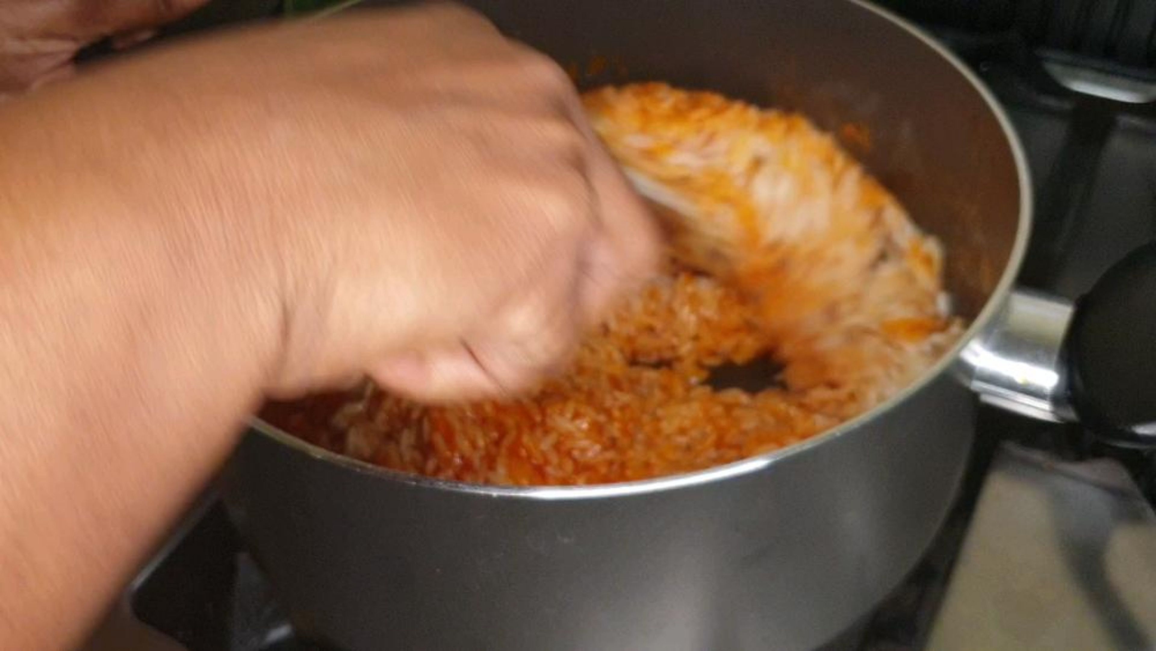 Give it some elbow power and keep mixing making sure every single grain of rice is coated in the Jollof base. you've got this! Well done 👌🏽. The 2 secrets of Perfect Jollof rice is 1) a tasty base 2)making sure all the grains are fully coated in the Jollof base you have made!