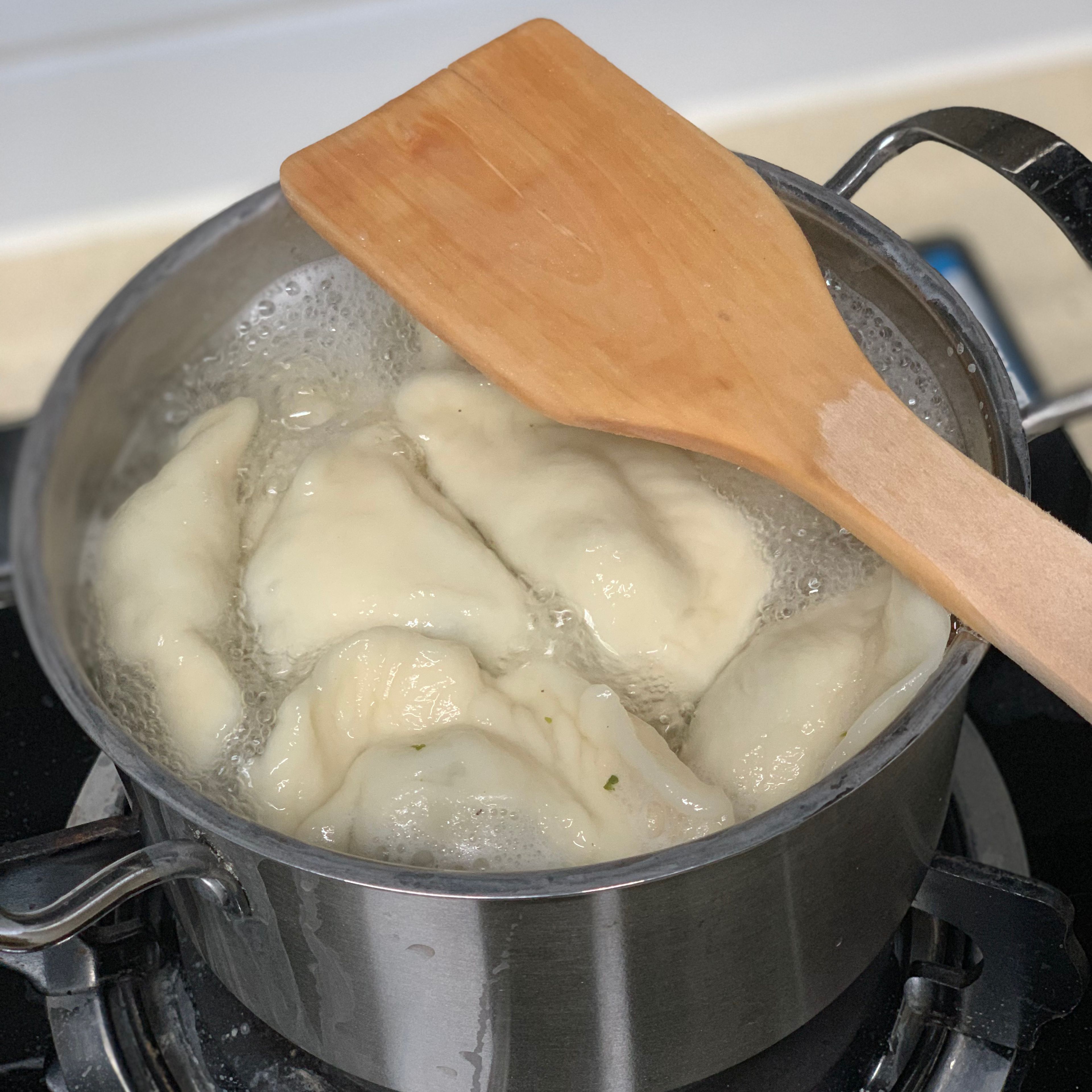 Half-fill a large saucepan with water and bring to a boil. Put inside the dumplings and cook them approximately 45 minutes.