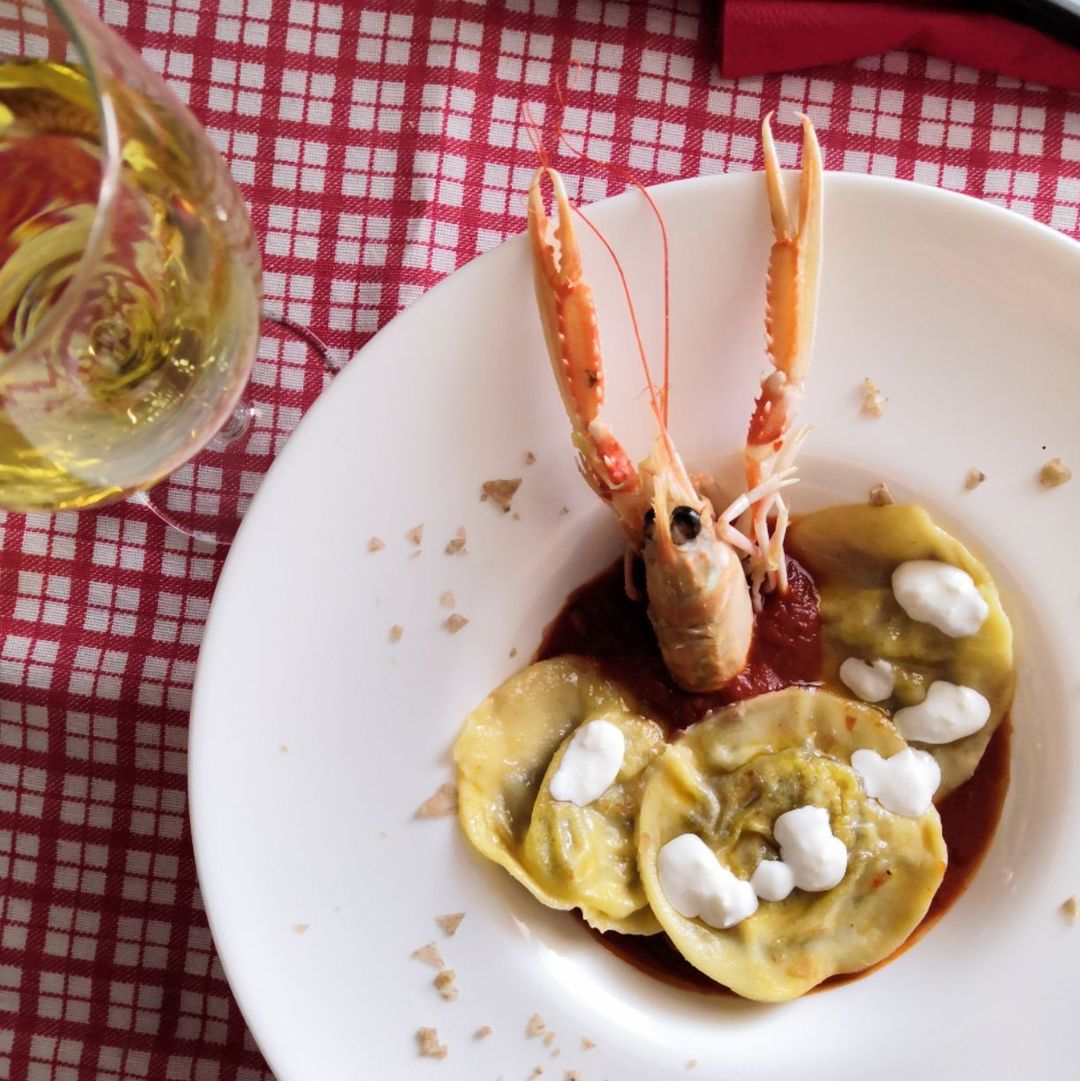 Pistachios and burrata ravioli with scampi sauce