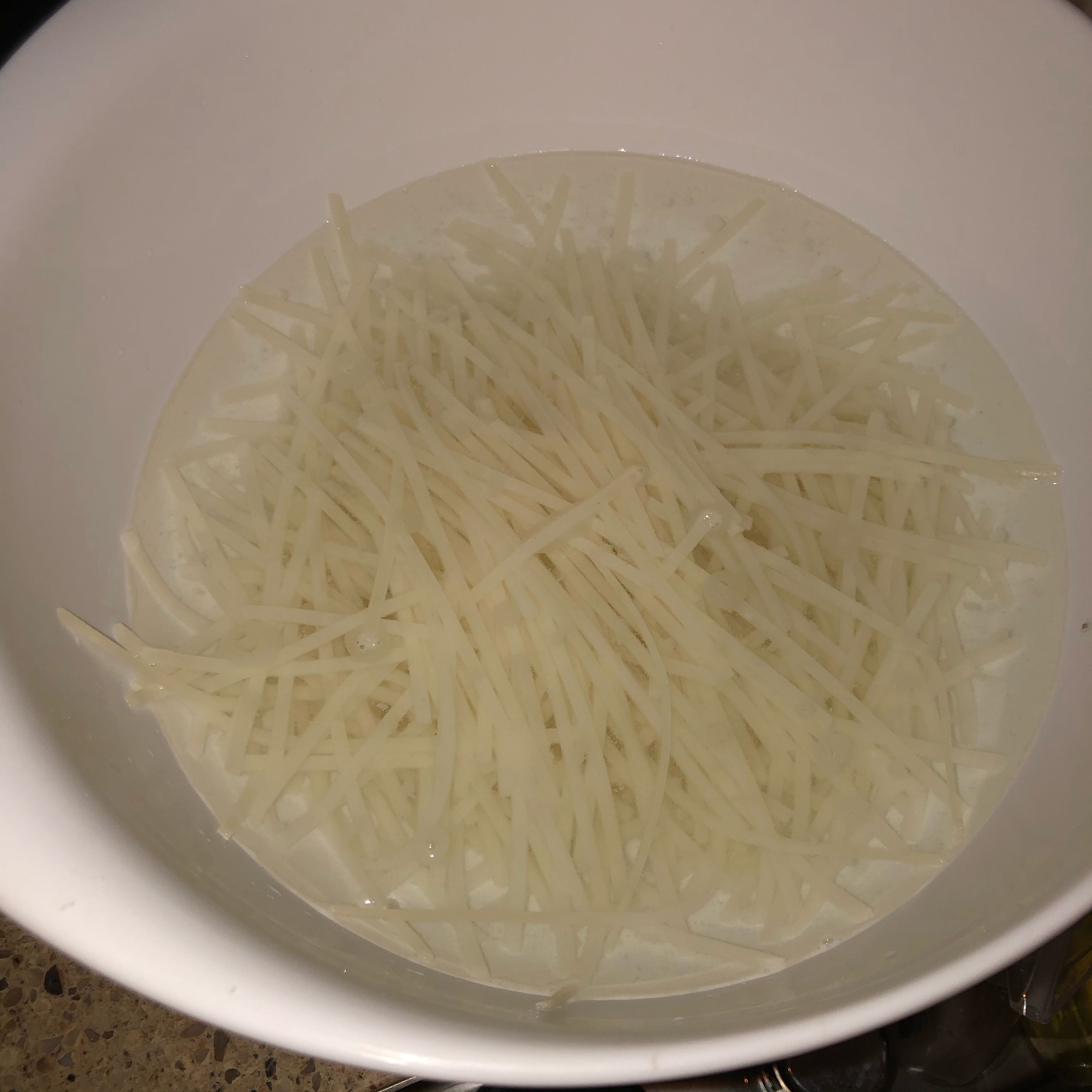 Place noodles in a bowl. Cover noodles with warm water for 20 minutes.