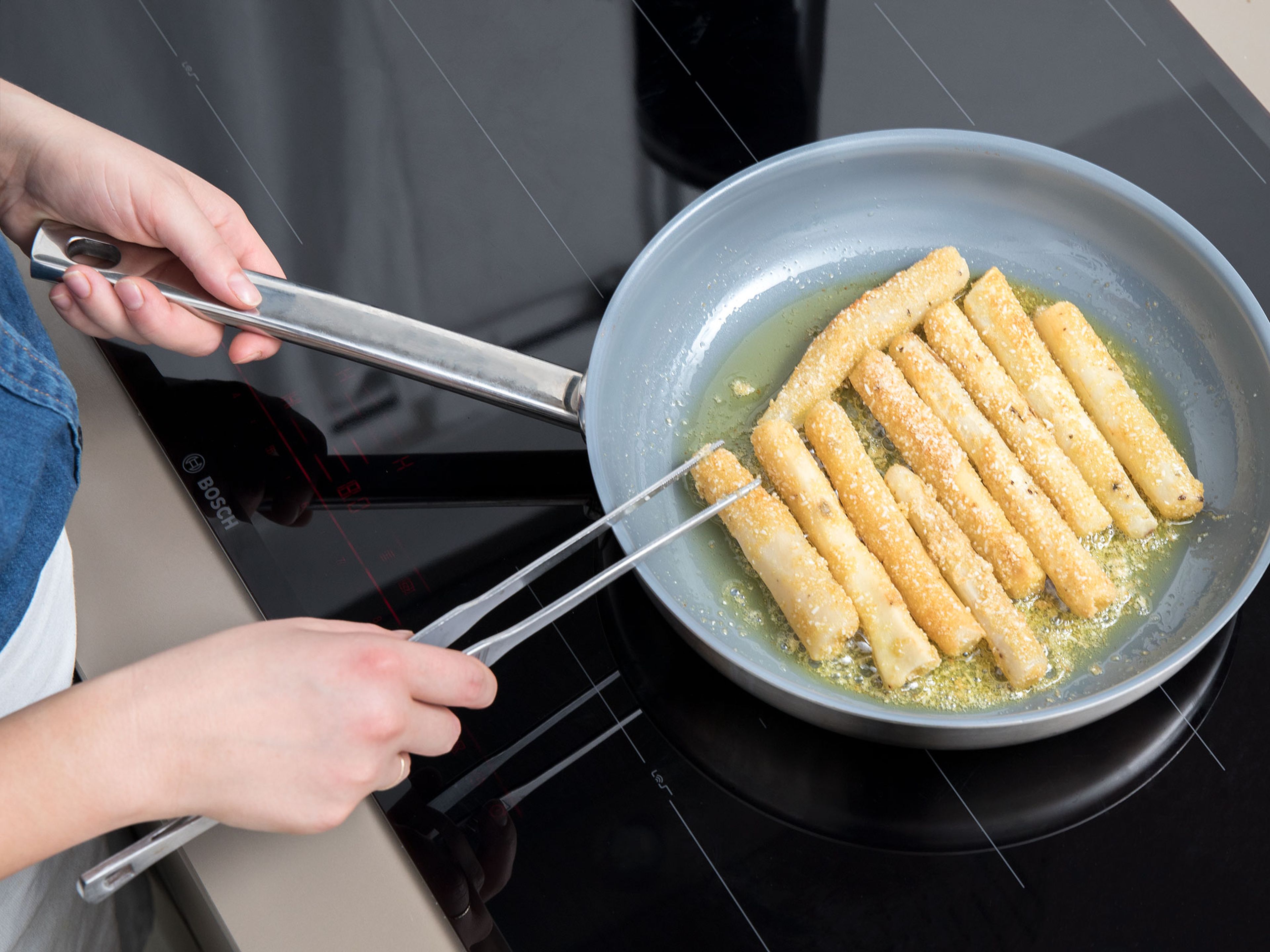 To prepare the fries, crack an egg into a bowl, season with salt, and whisk. Add enough oil to a large pan to shallow fry and heat over medium heat. Working in batches, dredge the sliced salsifies in the egg mixture, and then in rice-breadcrumbs, and transfer to the frying pan. Fry until golden all over.