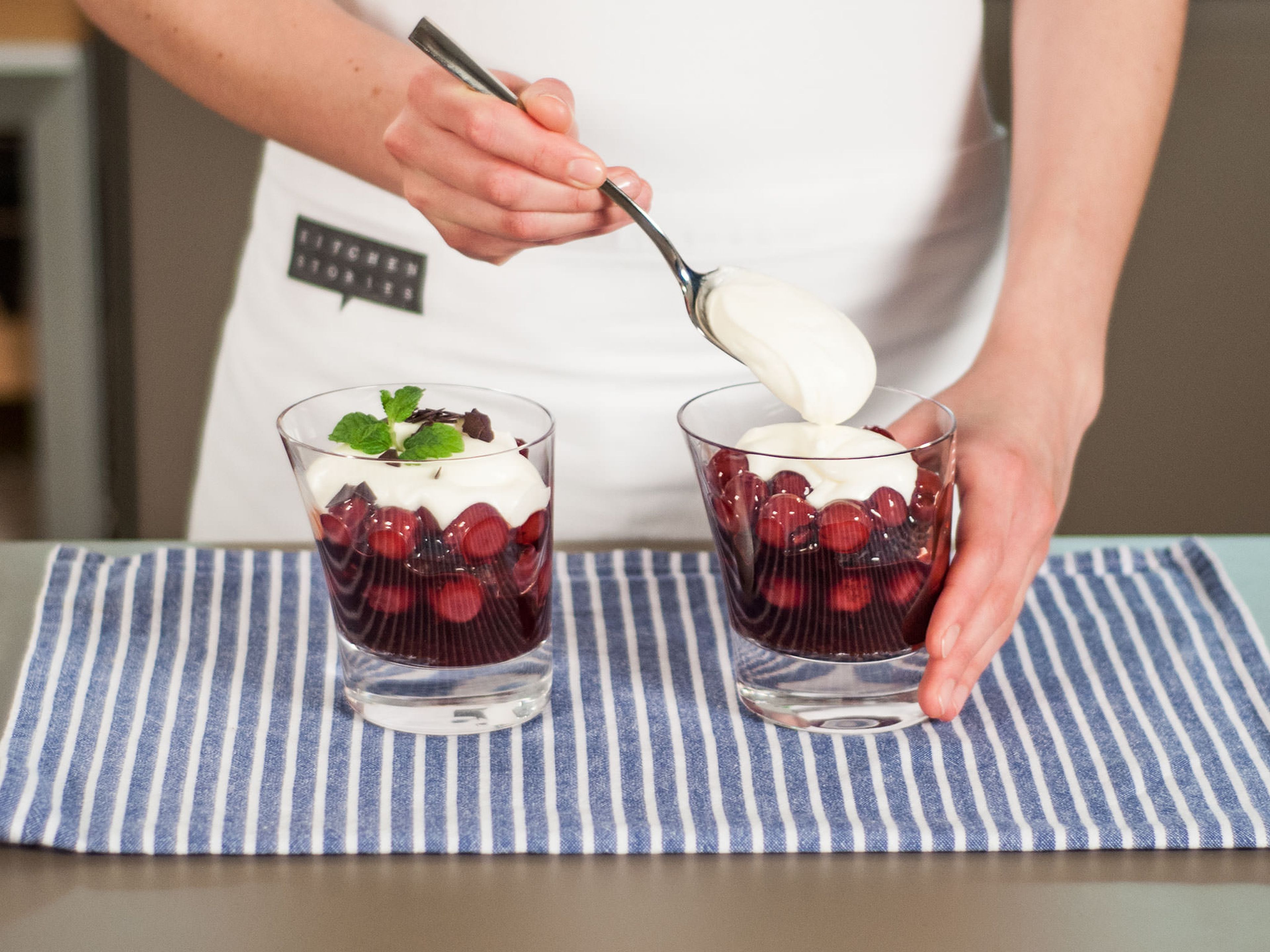 In a serving glass, layer the cake, cherry sauce, and whipped cream. Repeat. Garnish with mint and chocolate shavings. Enjoy!
