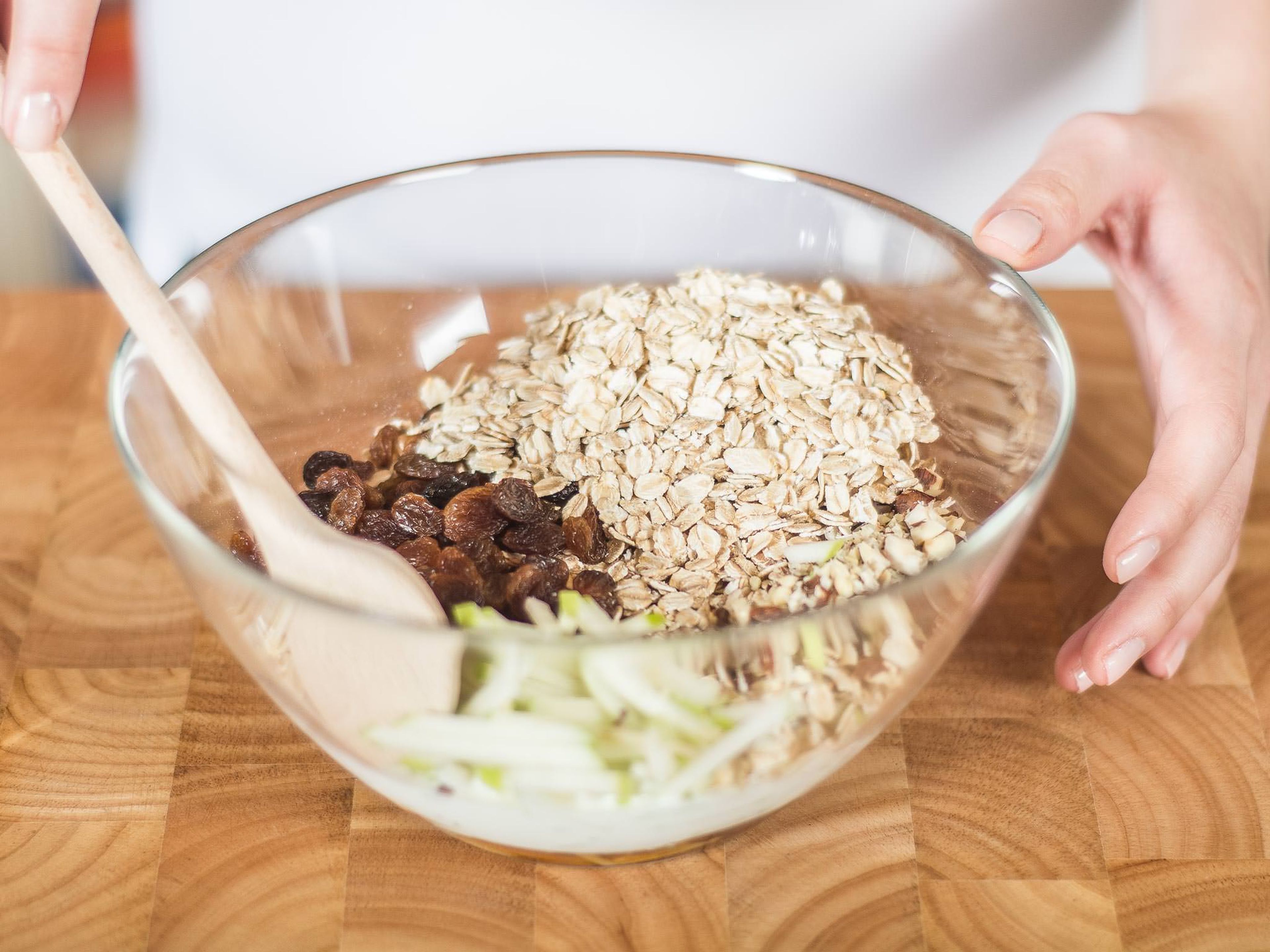 Add apples, hazelnuts, oat flakes, and sultanas to the blended yogurt. Steep for a few hours or overnight before serving to allow the oats to become soft.