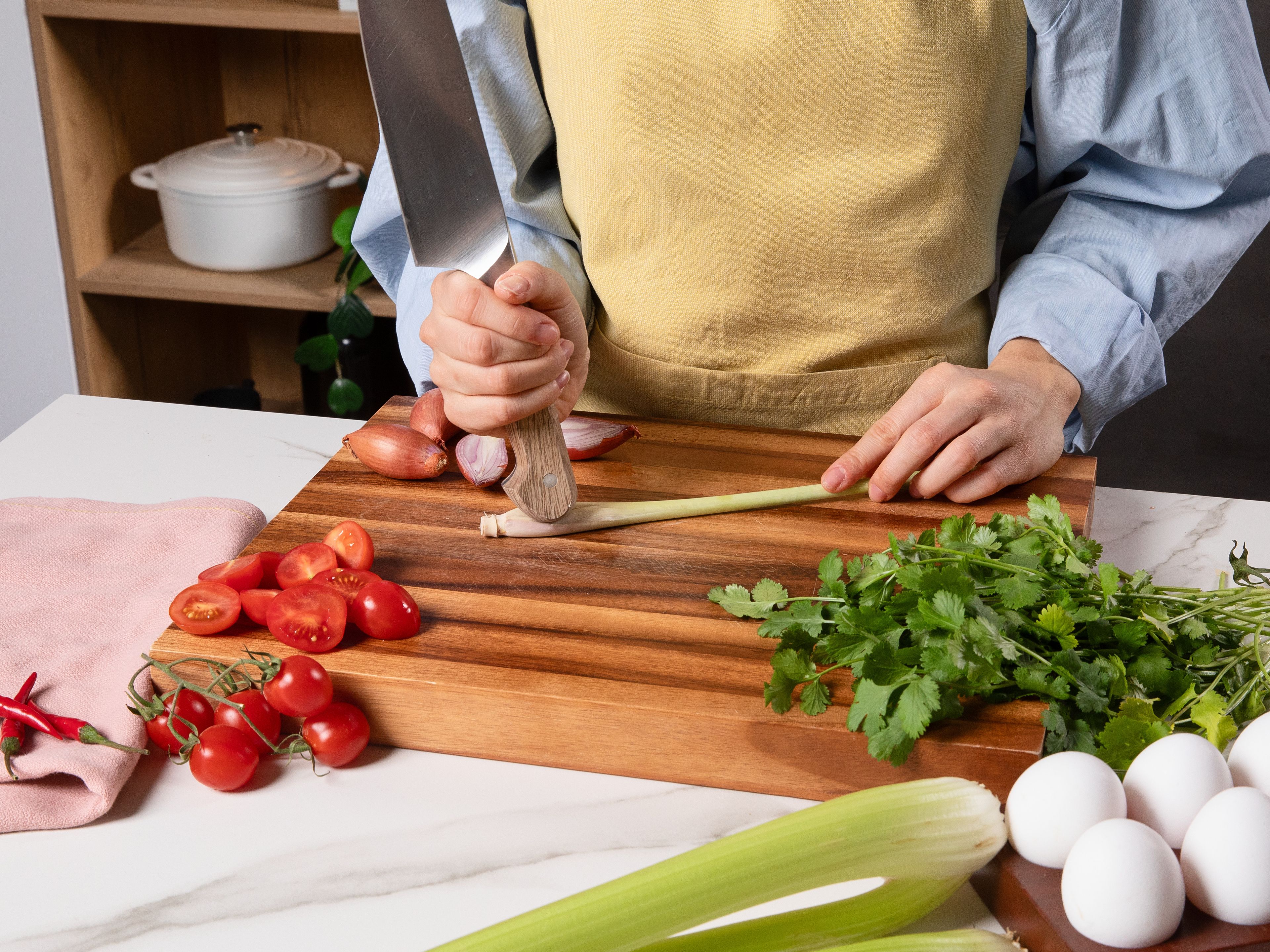 Remove the tough outer layer of the lemongrass, lightly crush it with the back of a knife and slice into very fine rings. Peel and thinly slice shallot. Peel and finely chop garlic. If desired, remove the seeds from the chilies, then slice into fine rings.  Roughly chop coriander, including the stems, and set a few leaves aside for garnish. Halve tomatoes and cut the celery into rough chunks.