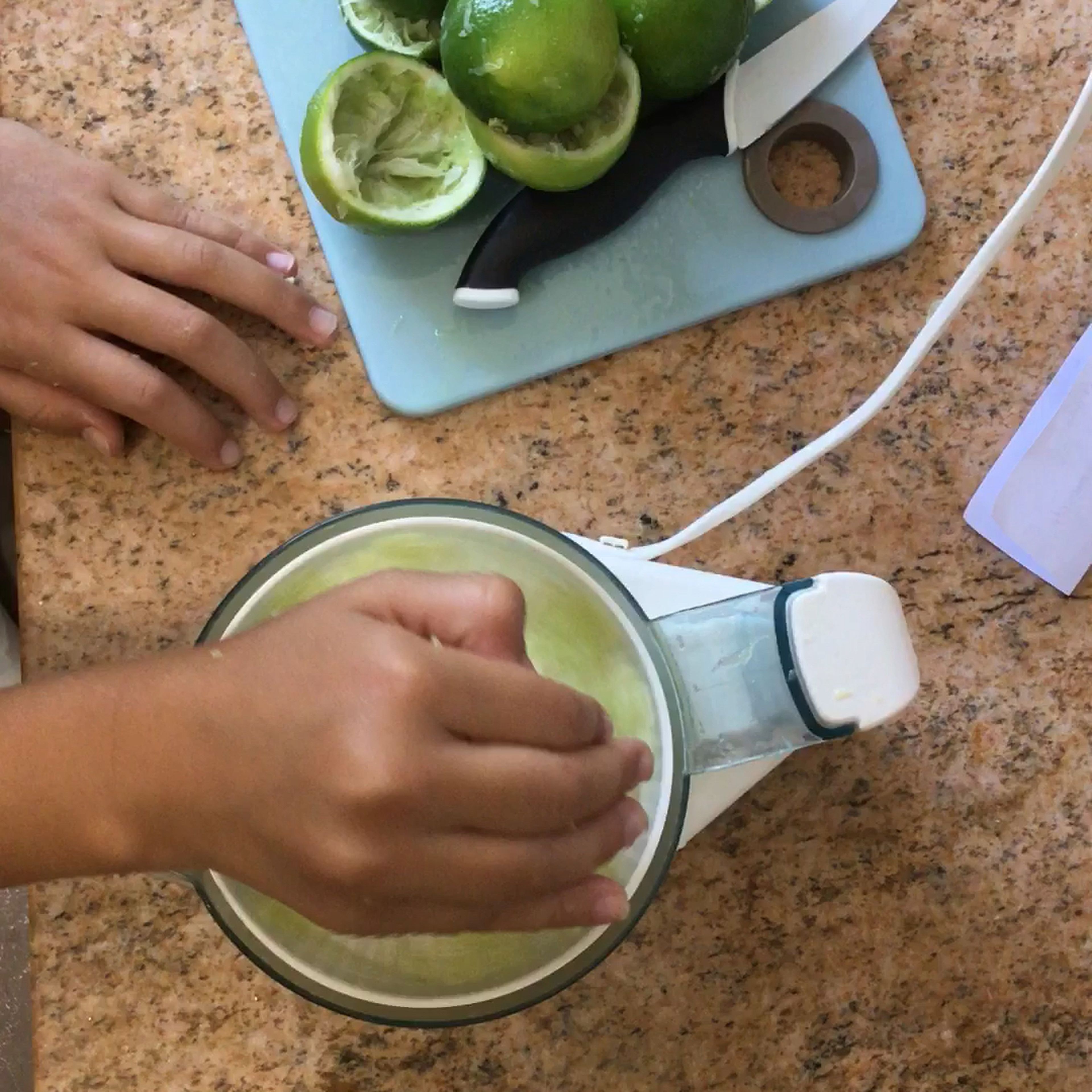 Squeeze the limes and pour them into a bowl.