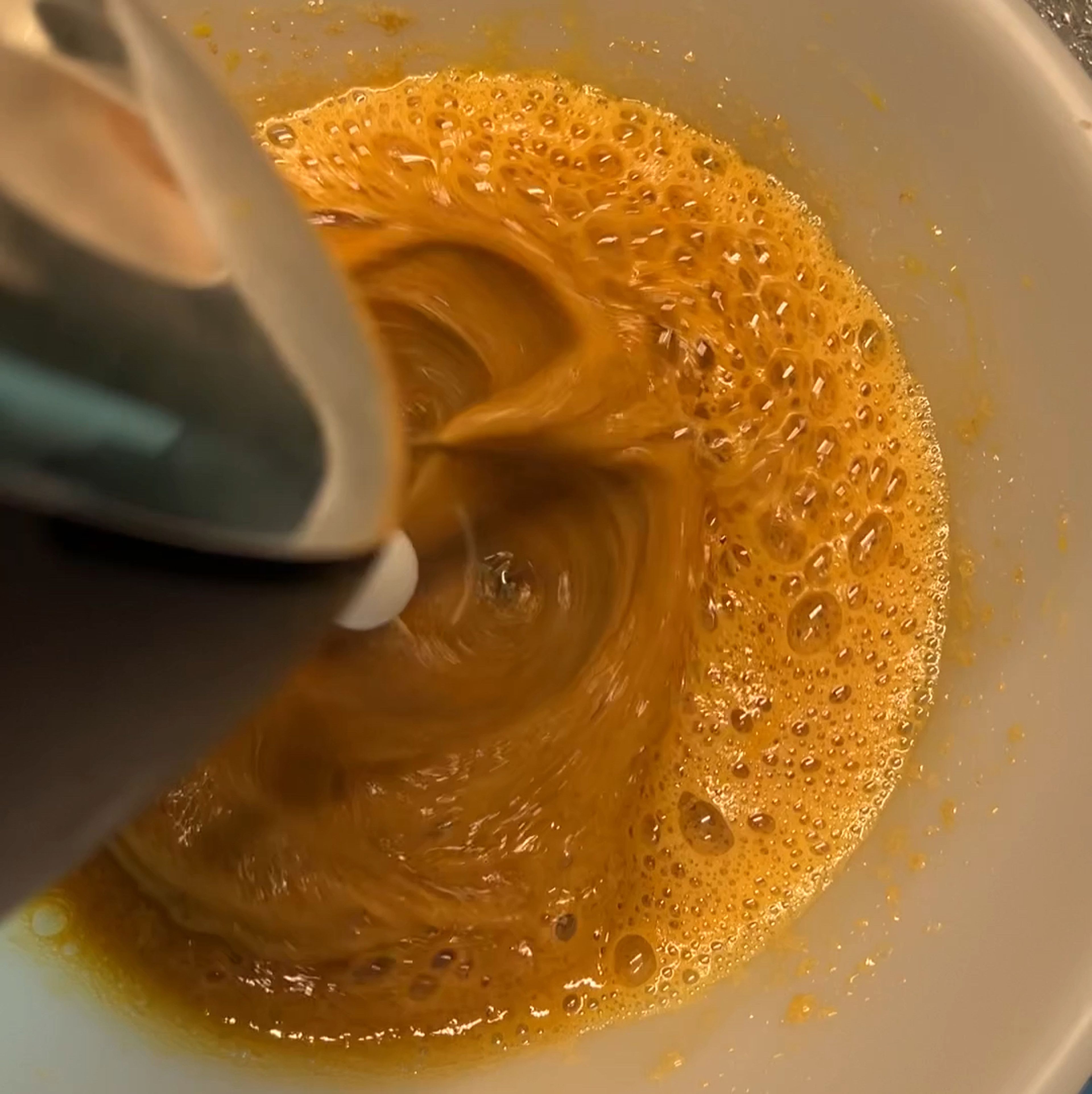 In another bowl beat eggs and sugar with a hand mixer until the mixture becomes pale and a little fluffy.