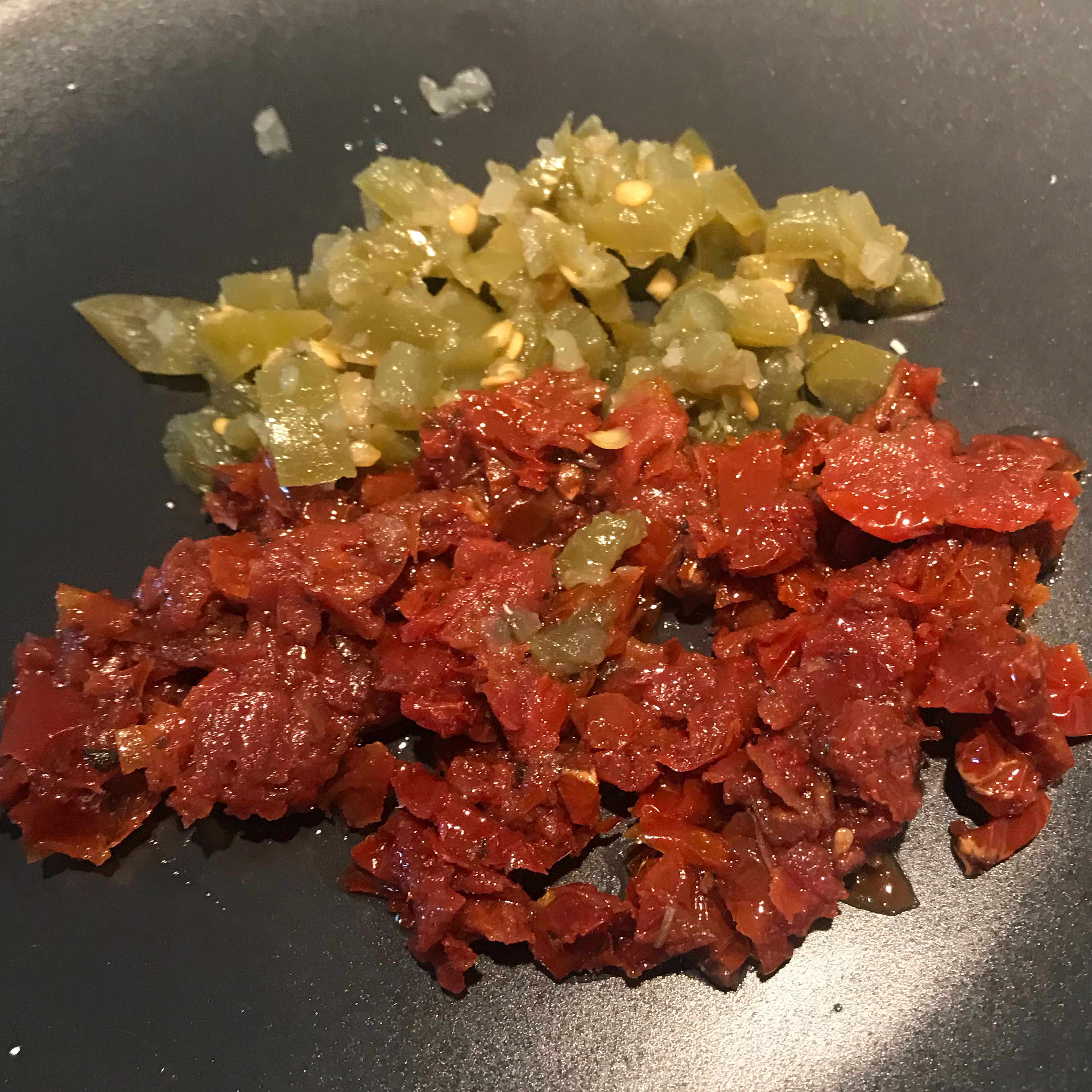 Add chopped dried jalapeno and tomatoes to the pan and fry 1-2 minutes