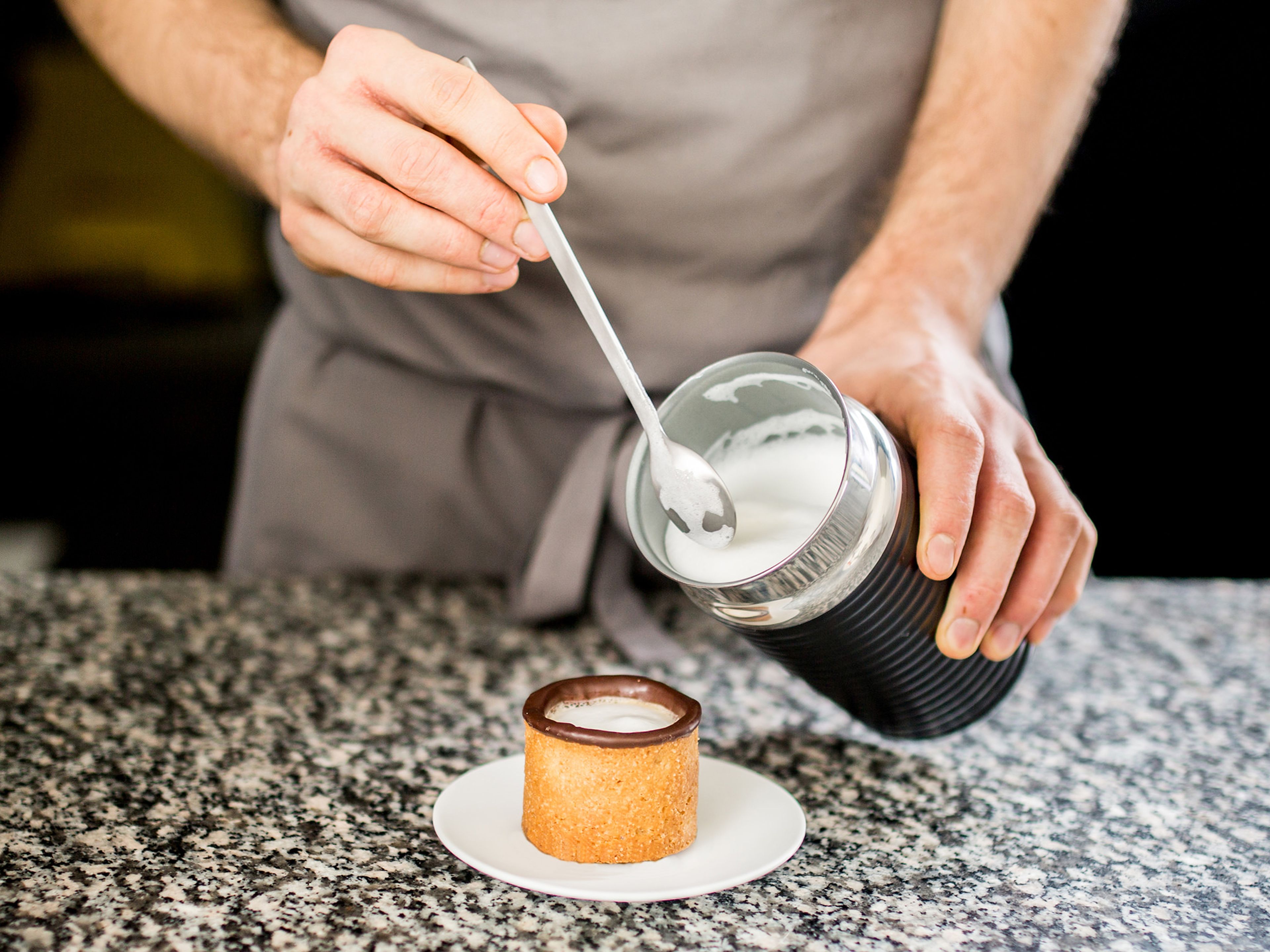Once chocolate has set, the cups are ready to be filled with espresso. If you like, top the espresso with milk foam. Enjoy!
