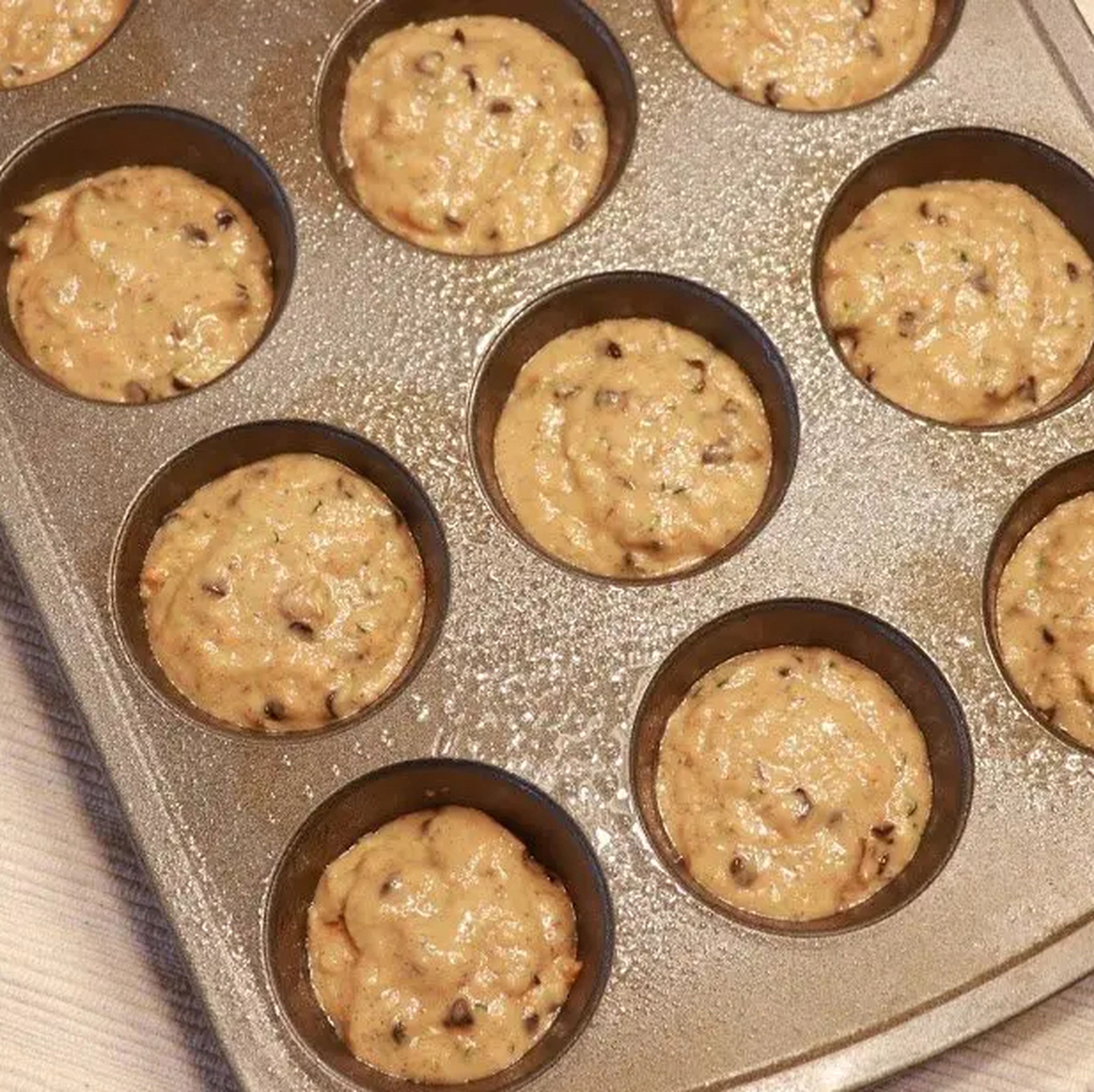 Fill prepared muffin cups about two-thirds full with muffin mixture.