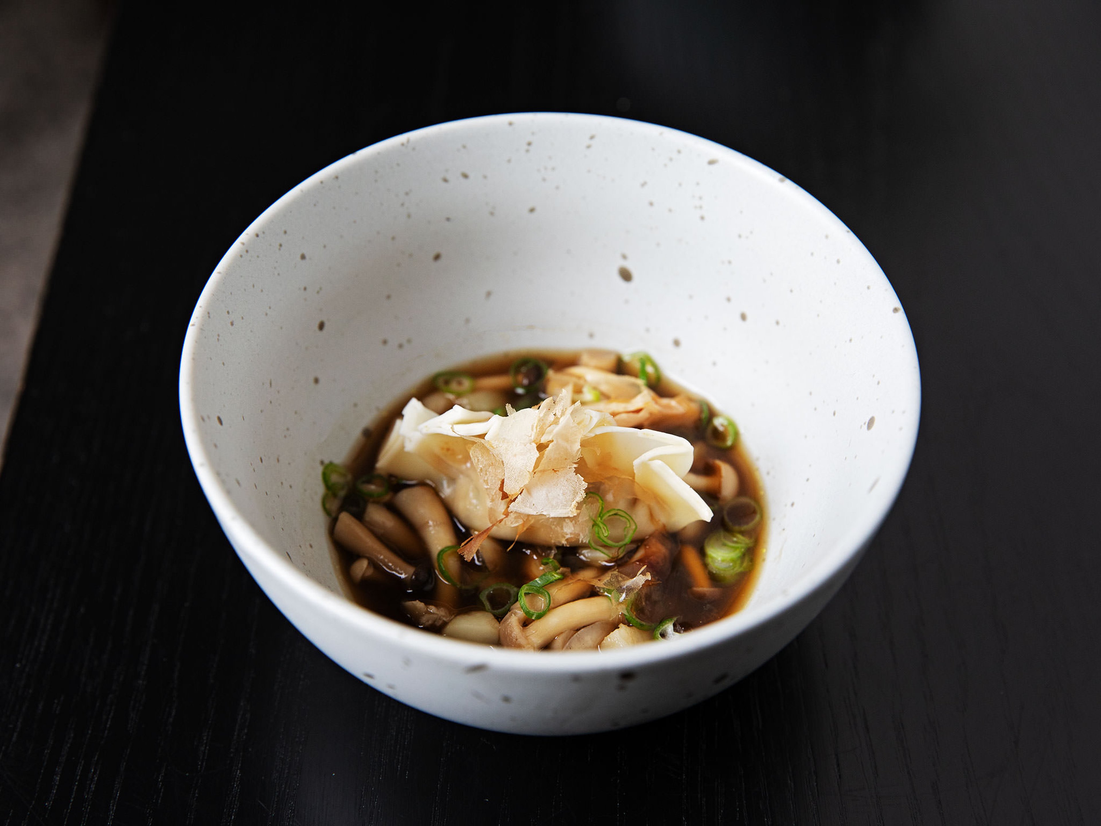 Spiced tofu dumplings with mushroom broth