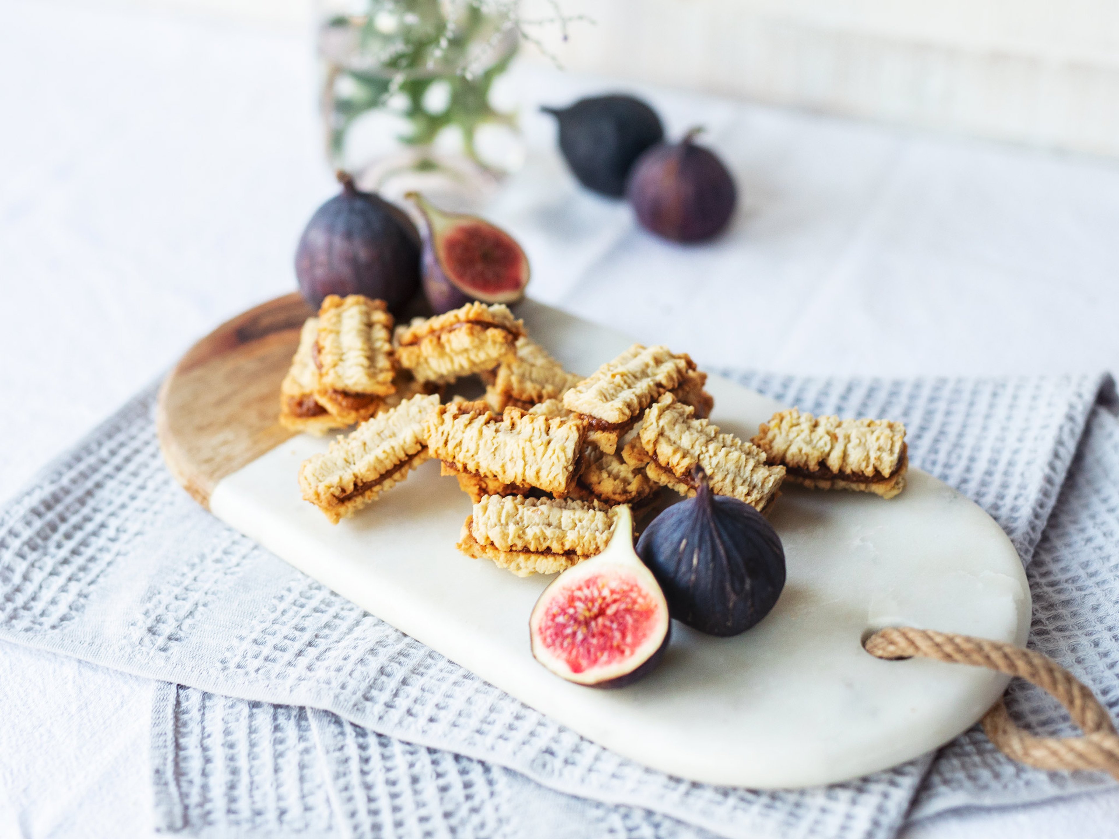 Walnut spritz sandwiches with fig-caramel filling