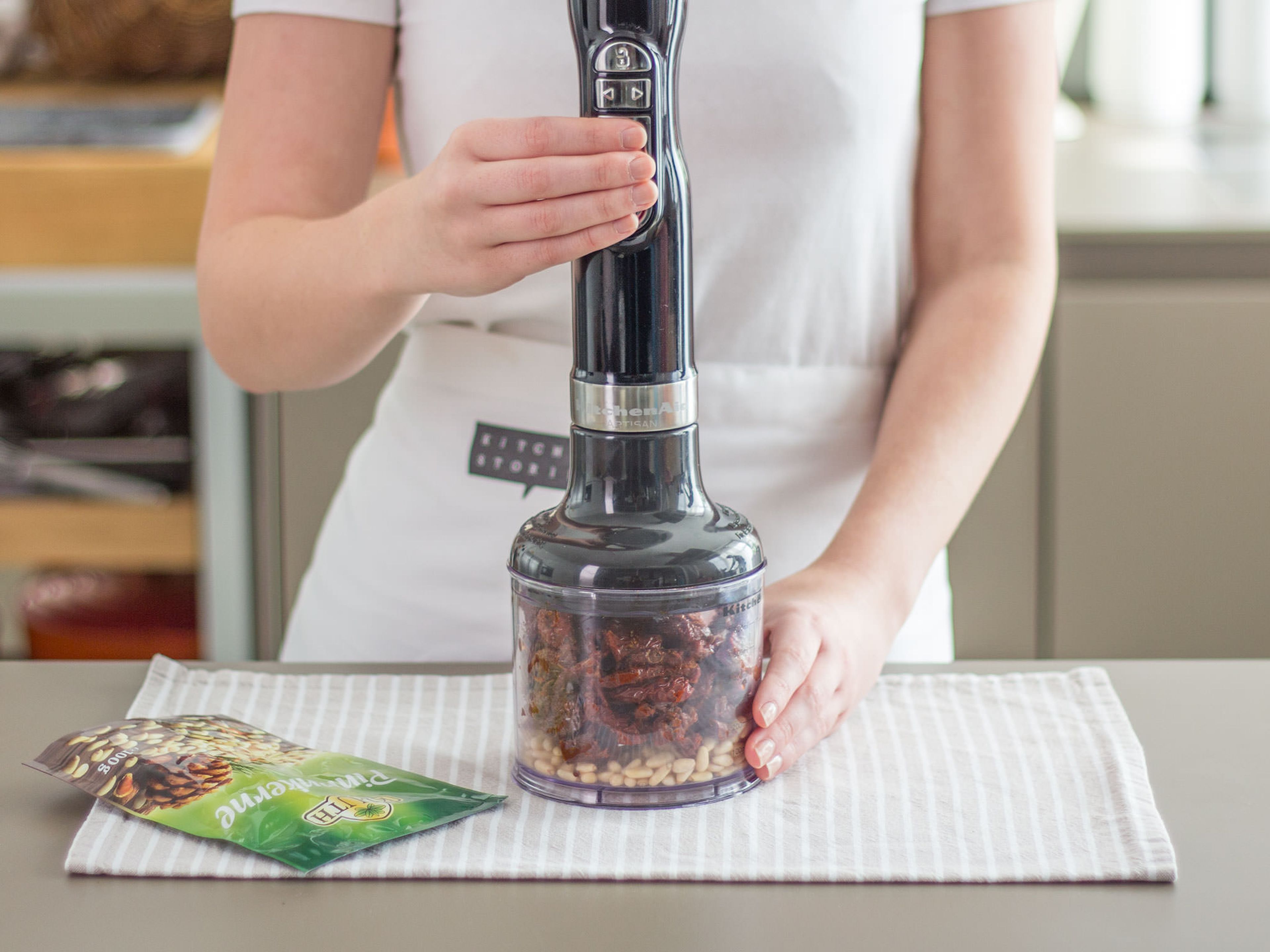 In a food processor, pulse sun-dried tomatoes and pine nuts into a smooth paste. Season to taste with salt and pepper.