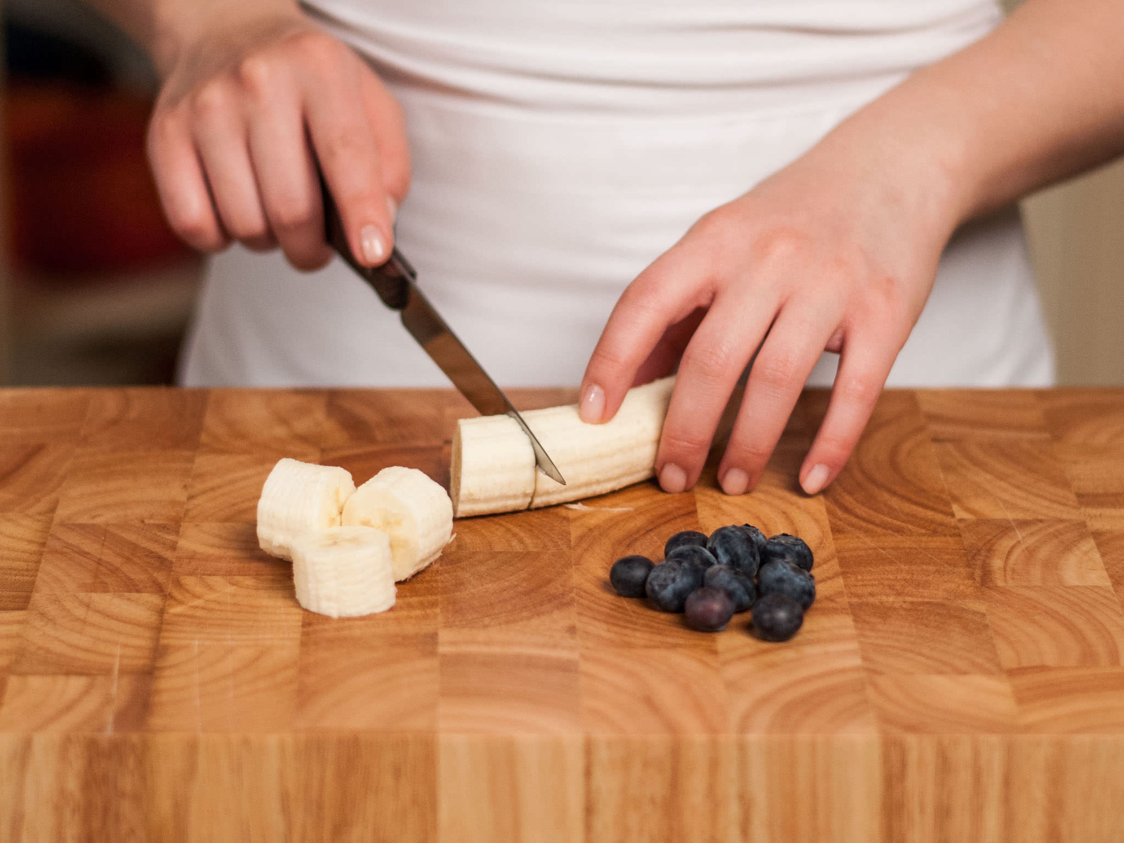 Peel bananas, cut into bite-sized pieces, and freeze with blueberries for at least 5 hours or overnight.