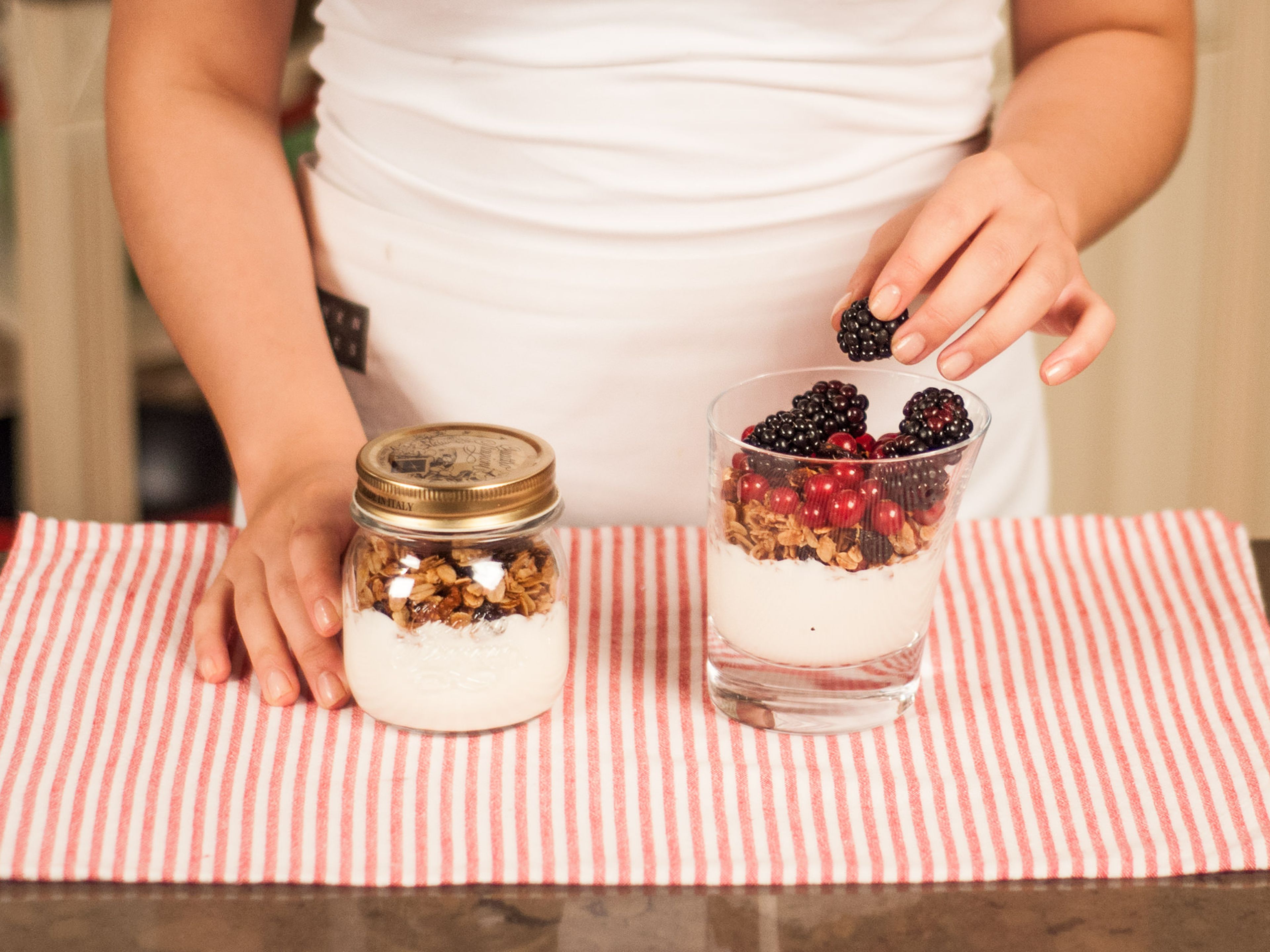 In a glass, layer the yogurt and the granola. Top with berries. Serve with more maple syrup and cinnamon for a sweeter flavor. Enjoy!