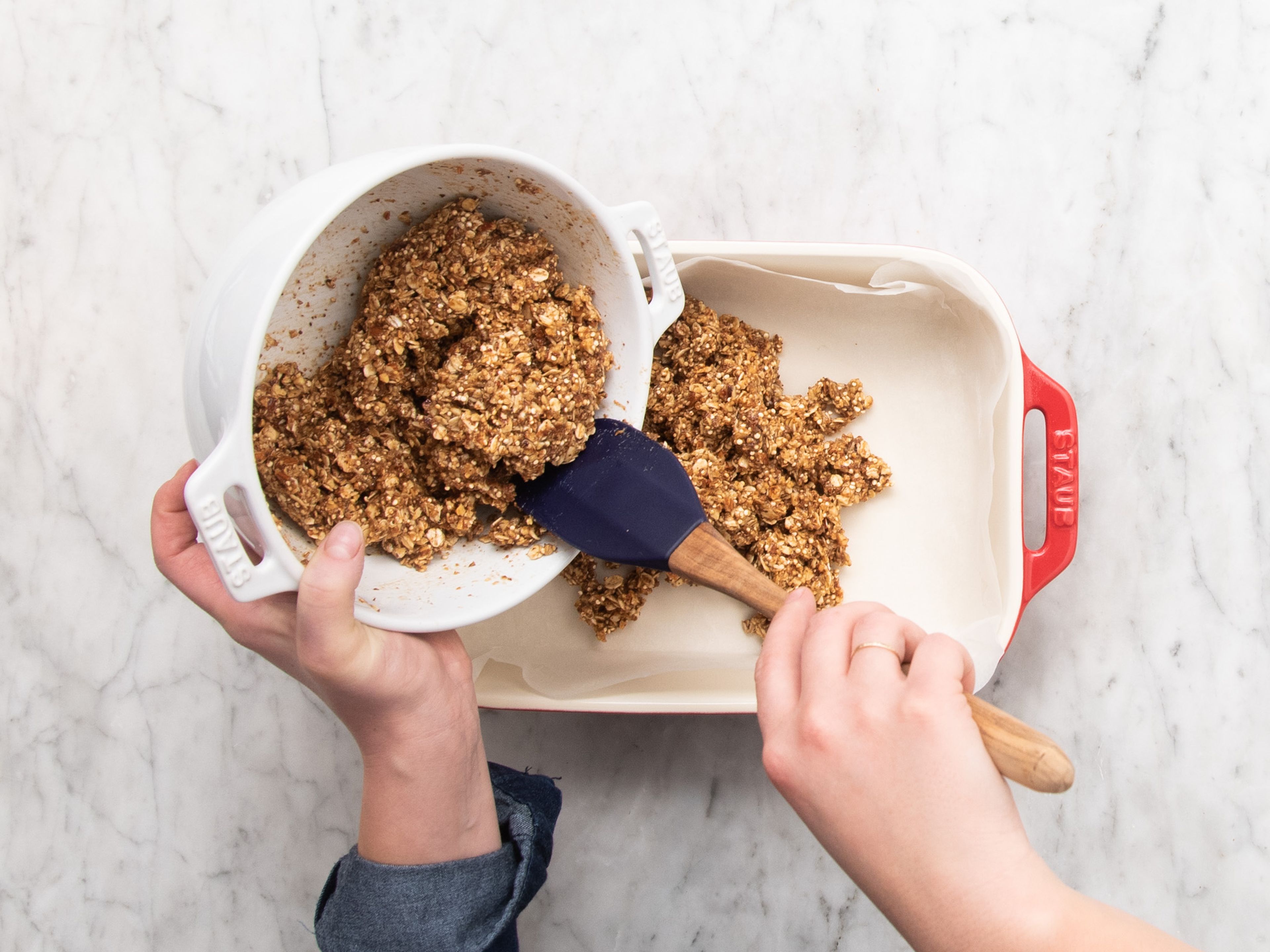 Transfer the mixture to a parchment-lined baking dish, press down firmly, and smooth out. Refrigerate for approx. 1 hr., or until the energy bars have firmed up.