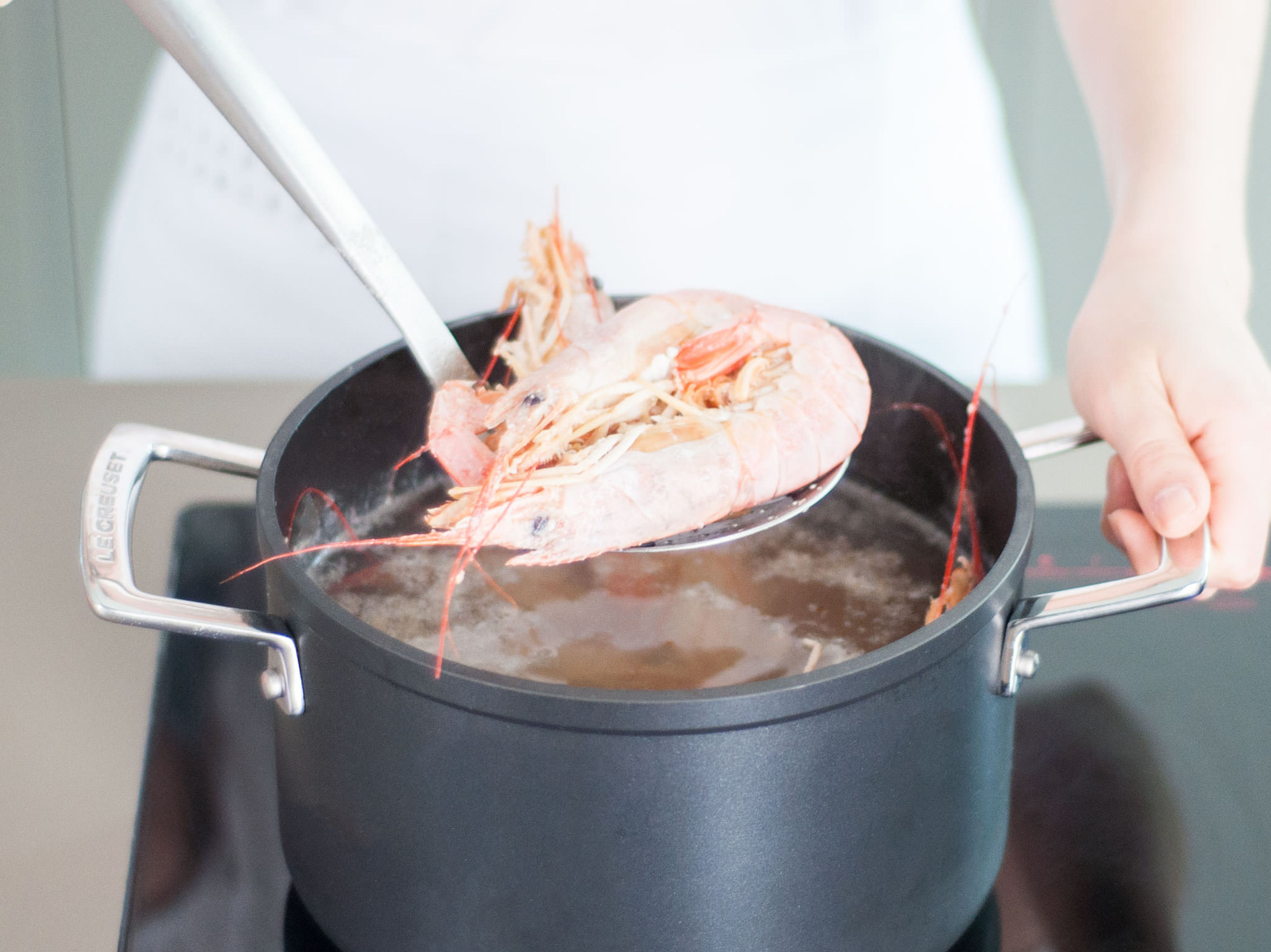 Bring a large pot of water to a boil; add wine if using. Add shrimp and cook until they turn white, approx. 2 min. Drain and set aside.