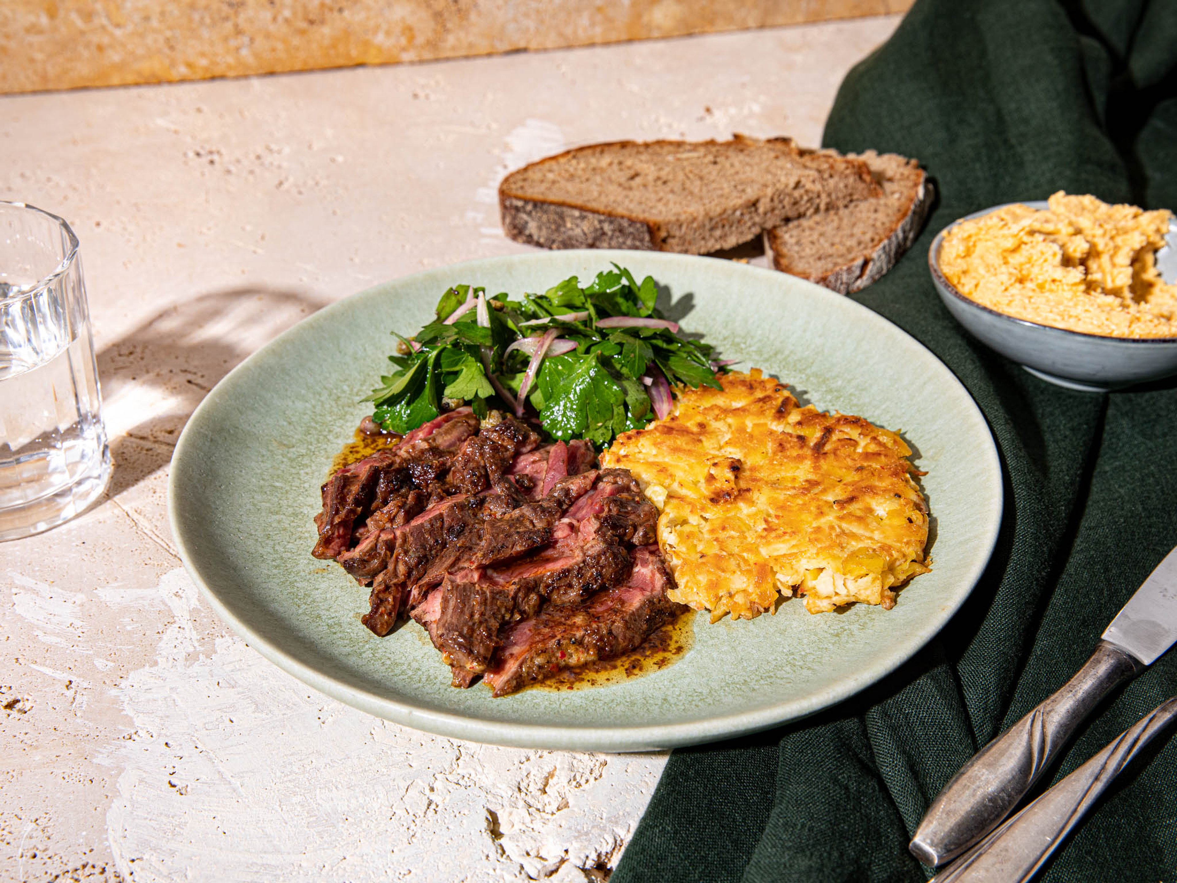 Steak with celery root rösti and kimchi butter