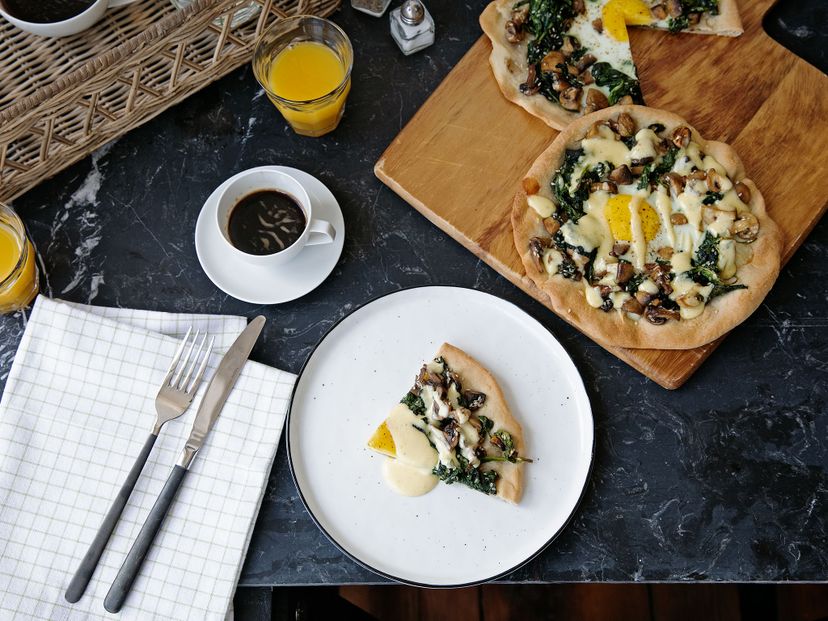 Breakfast pizza with mushrooms, spinach, and egg