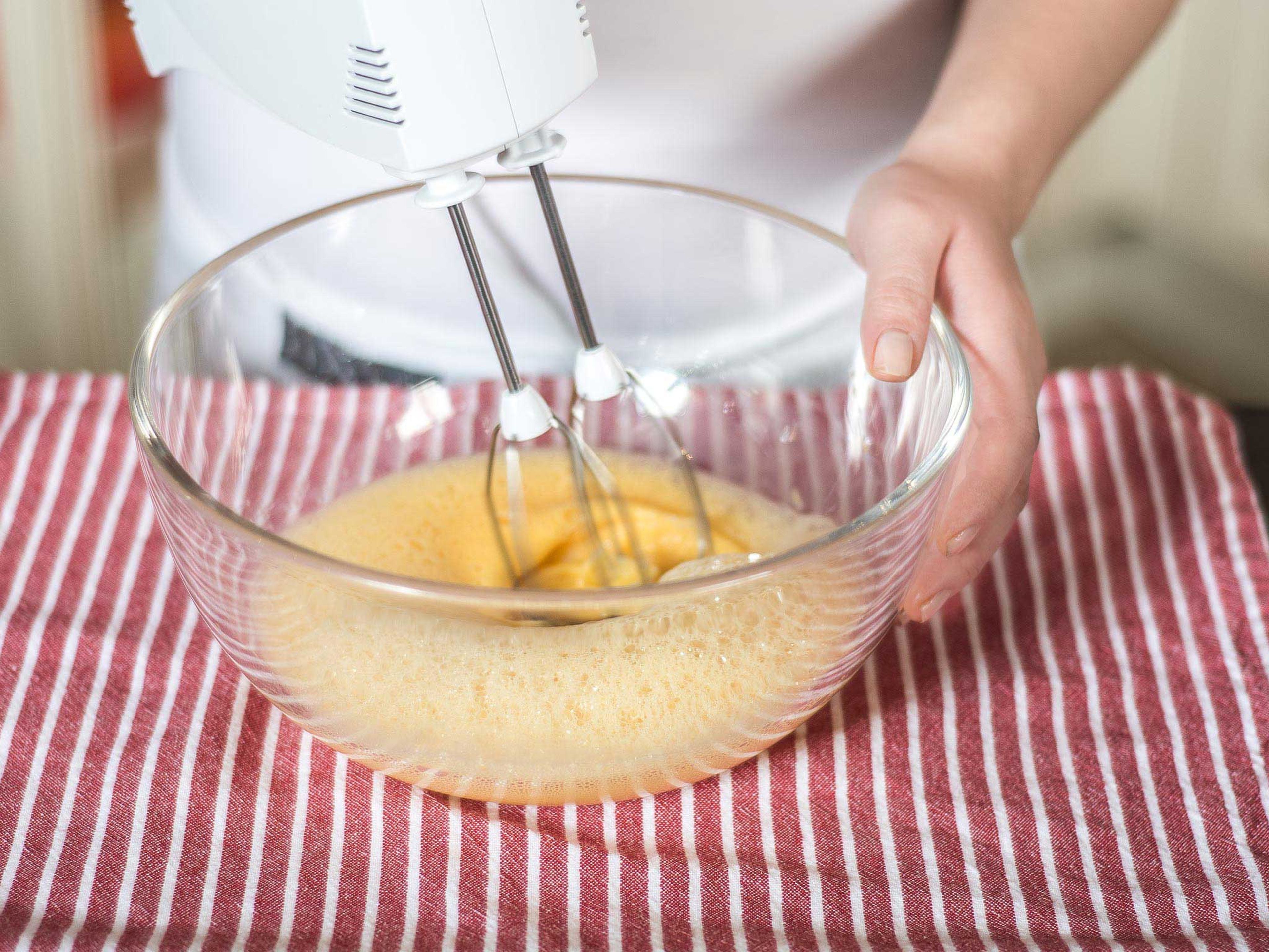 Beat eggs and egg yolks with hand mixer until fluffy.