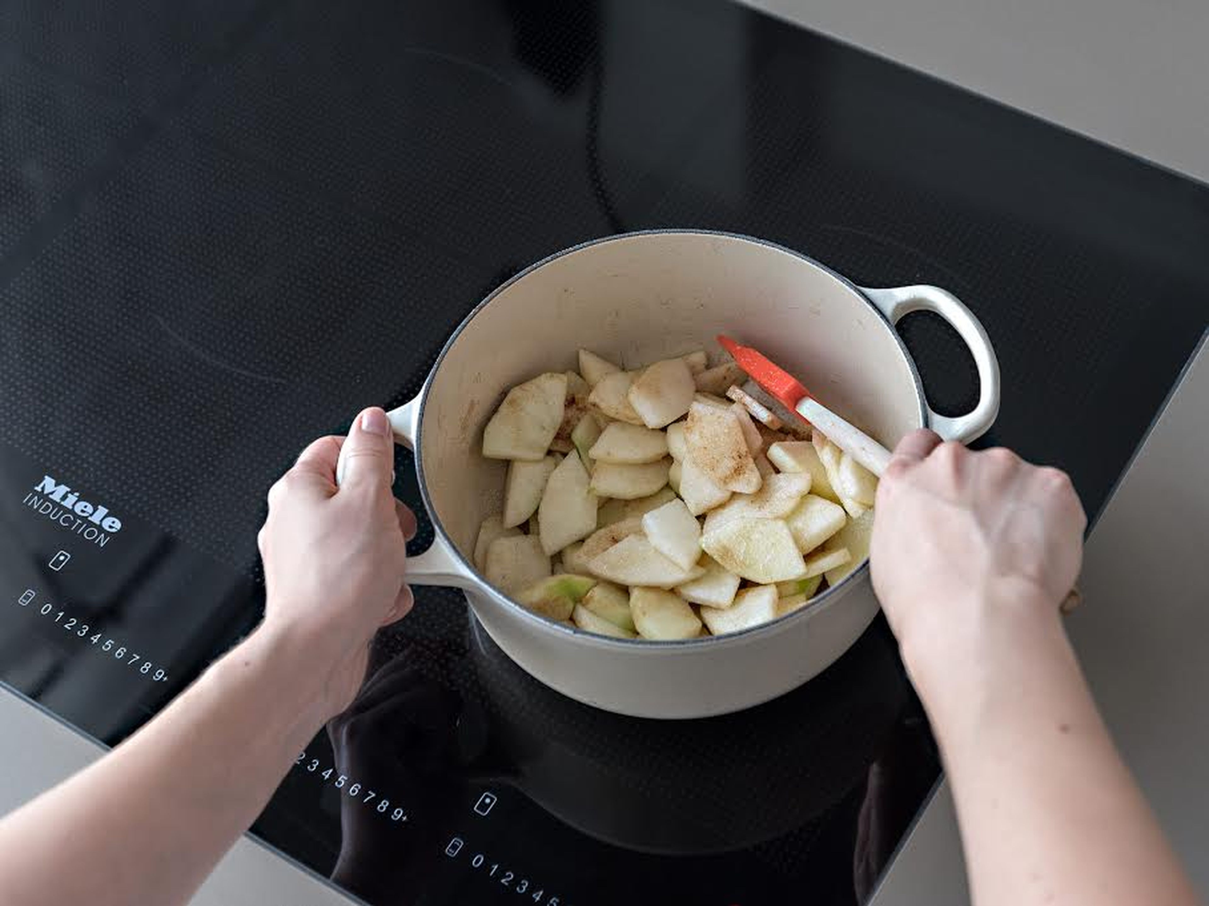 Meanwhile, peel apples, core, and thinly slice. Transfer to a saucepan with lemon juice, remaining sugar, cinnamon, and ground ginger and cook over medium-low heat for approx. 5 min., until slightly softened. Remove from heat and set aside to cool.