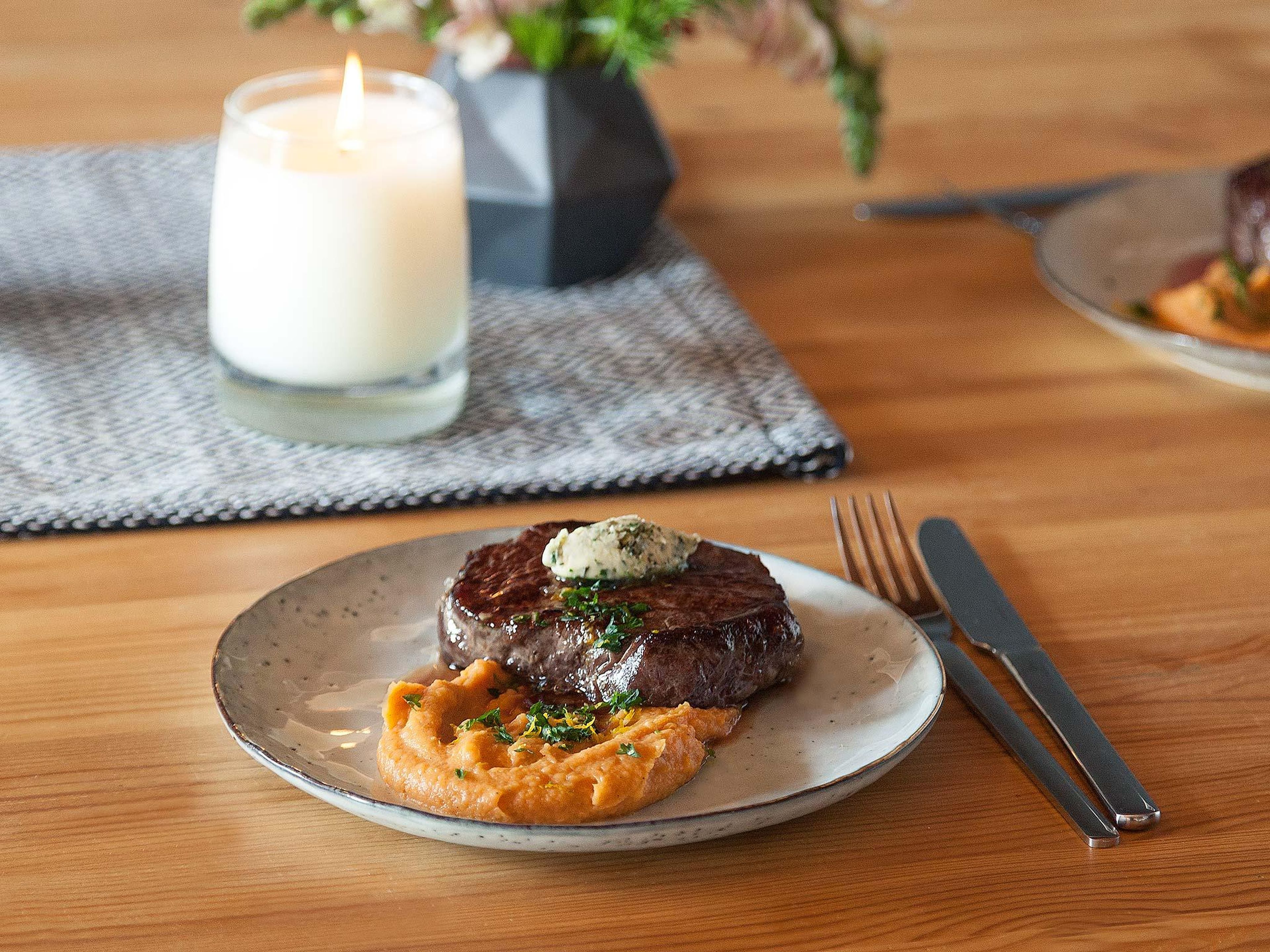Sous vide steak with sweet potato purée and herb butter