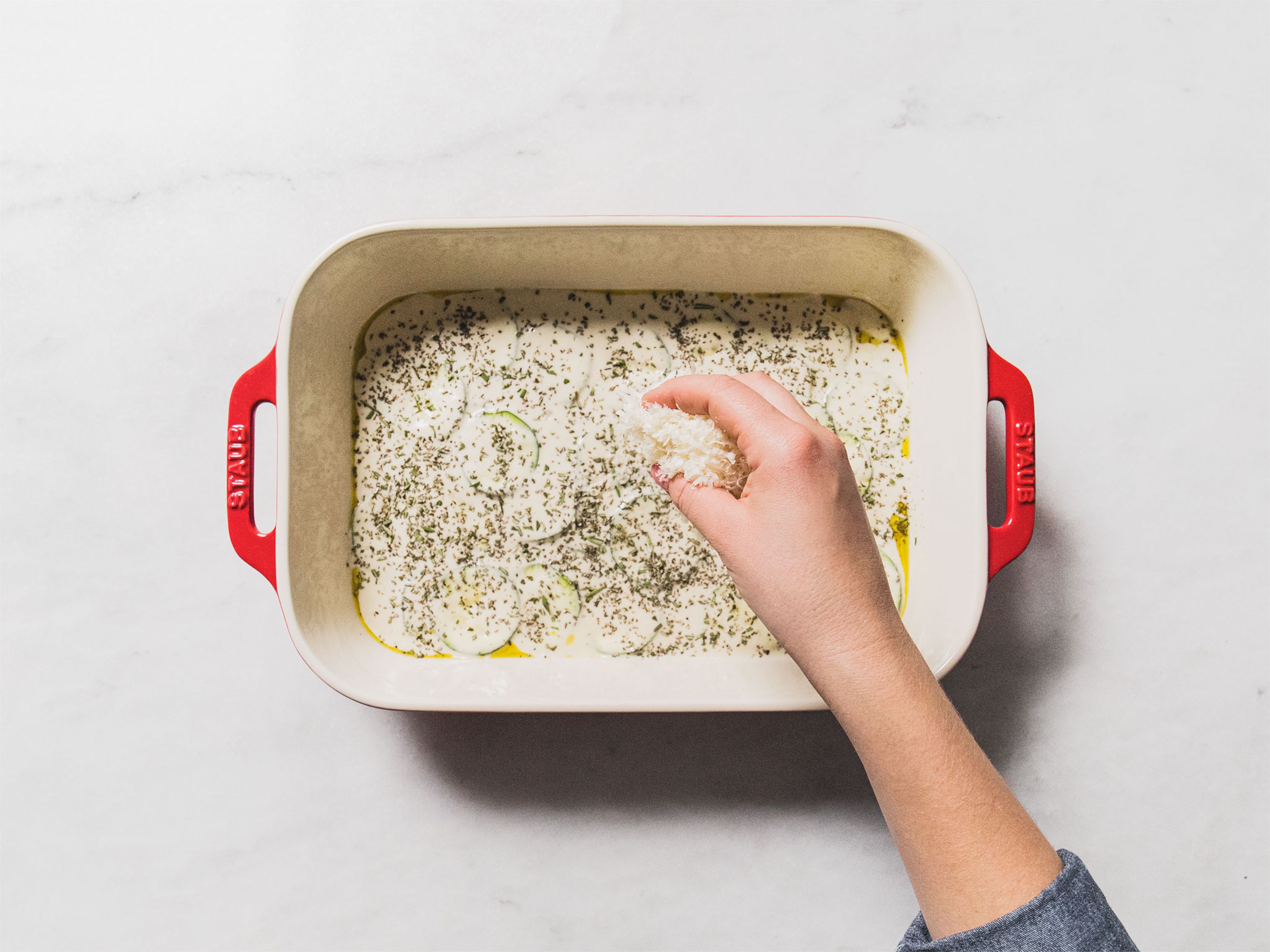 Spread the batter in a greased baking dish in as even a layer as possible. Top with chopped rosemary and Parmesan cheese. Drizzle with a little more olive oil and bake in the oven for approx. 40 min., or until golden brown. Serve immediately and enjoy!