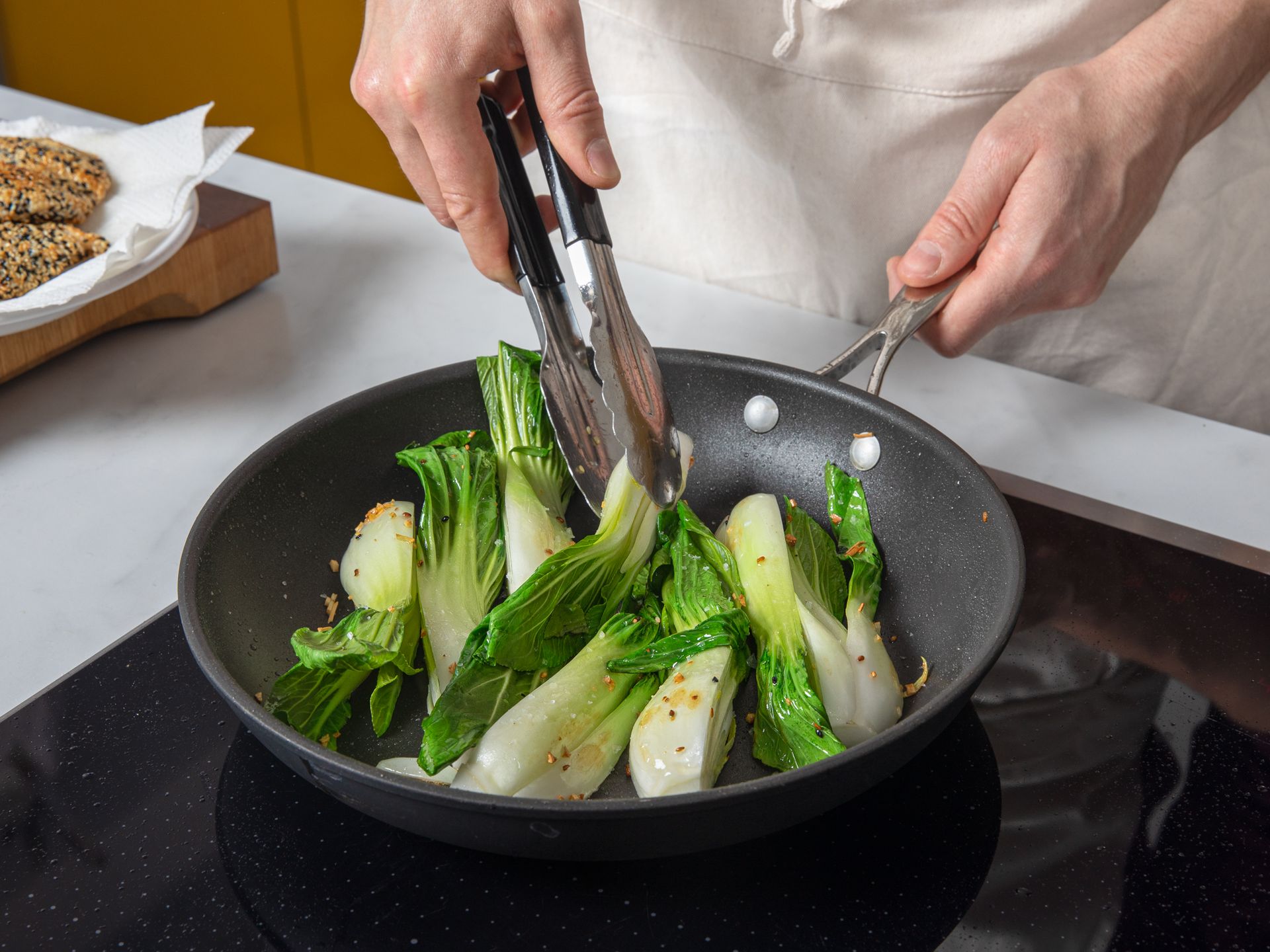 Crispy sesame chicken schnitzel with bok choy and peanut sauce Recipe