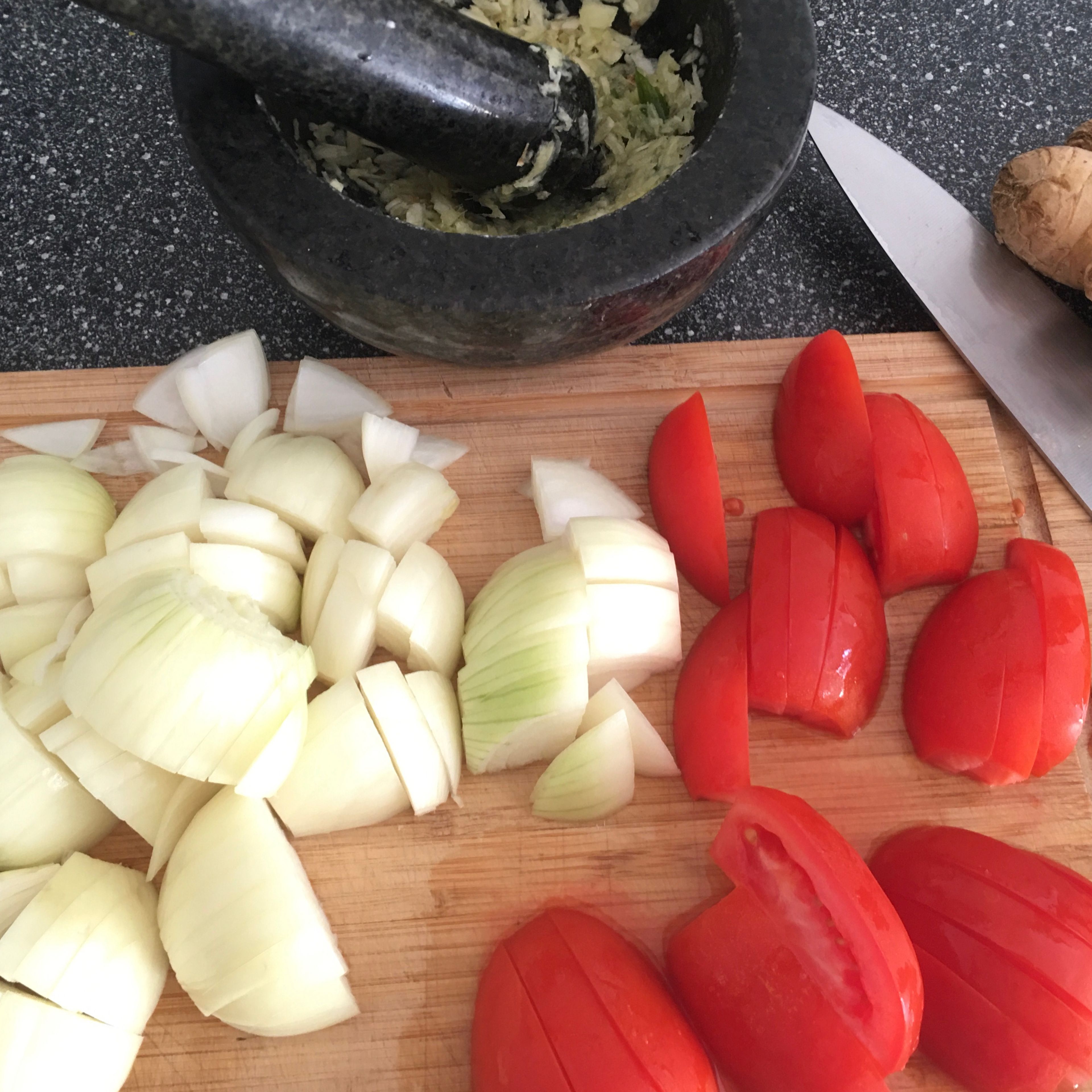 Roughly slice the onions and tomatoes. Crush/chop ginger and garlic. I usually prefer freshly ground ginger garlic paste for which I use my all-time favourite mortar and pestle.