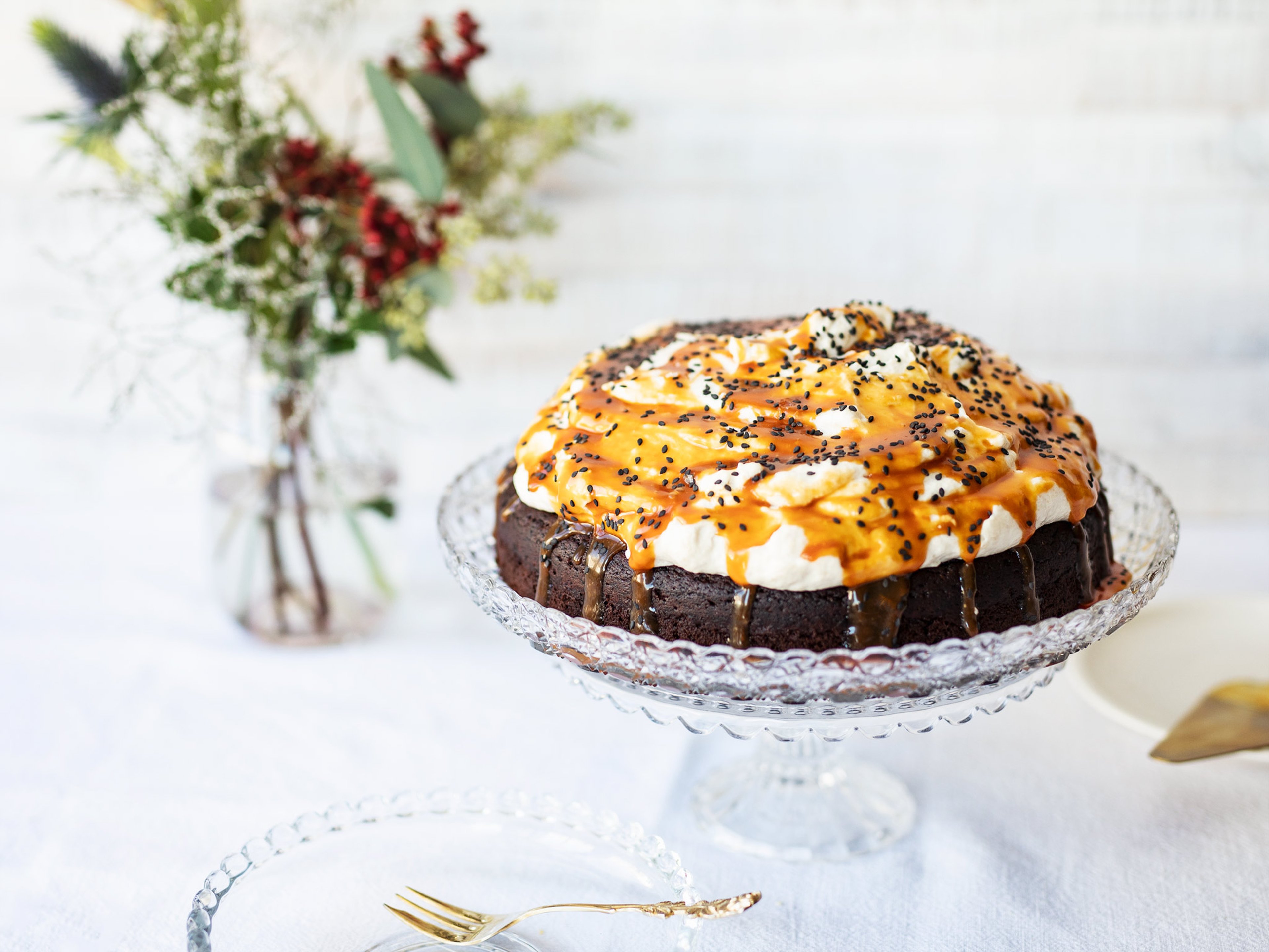 Chocolate cake with fluffy tahini frosting and salted caramel
